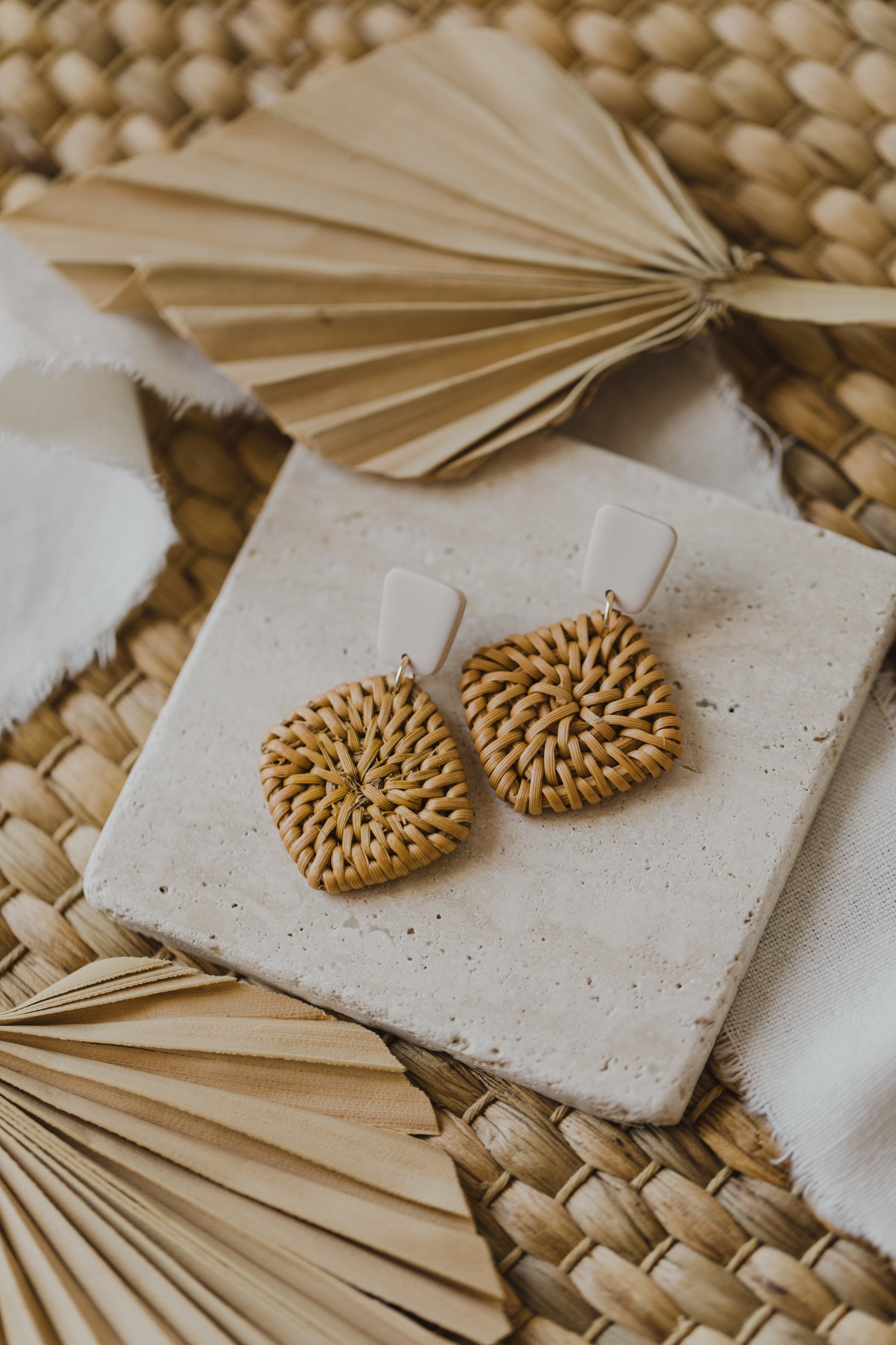 square polymer clay earrings in the color vanilla with rattan pendant square
