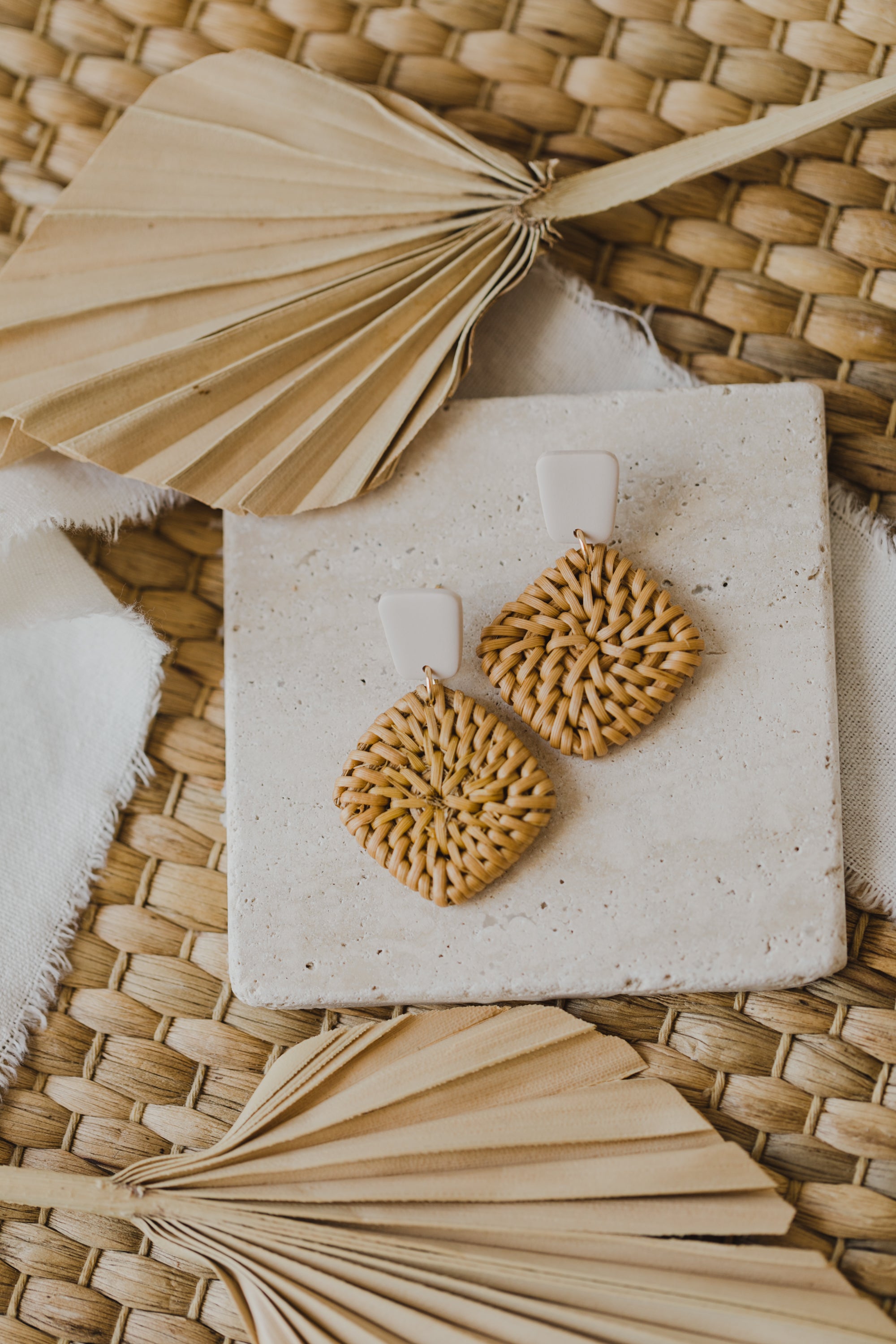 square polymer clay earrings in the color vanilla with rattan pendant square