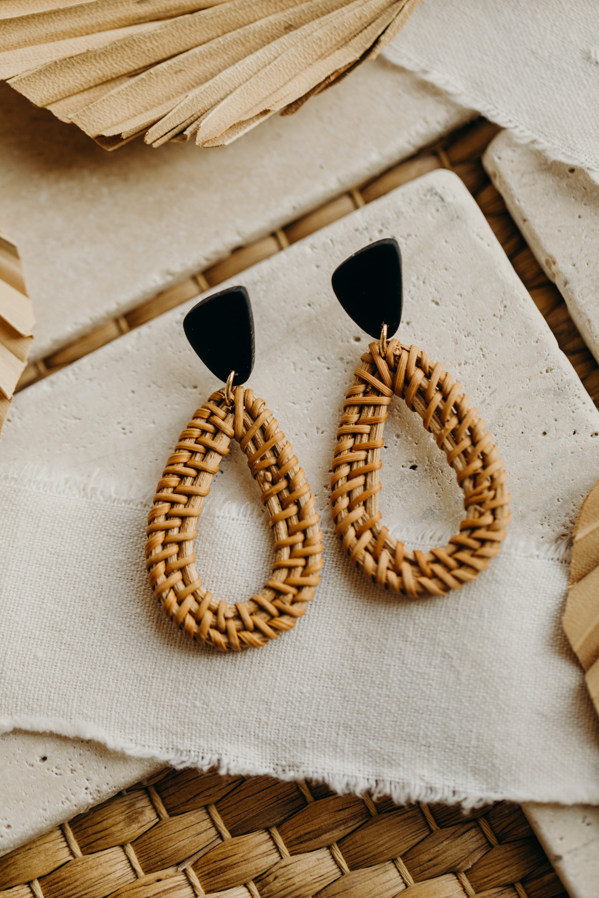 black polymer clay earrings with rattan pendant drops