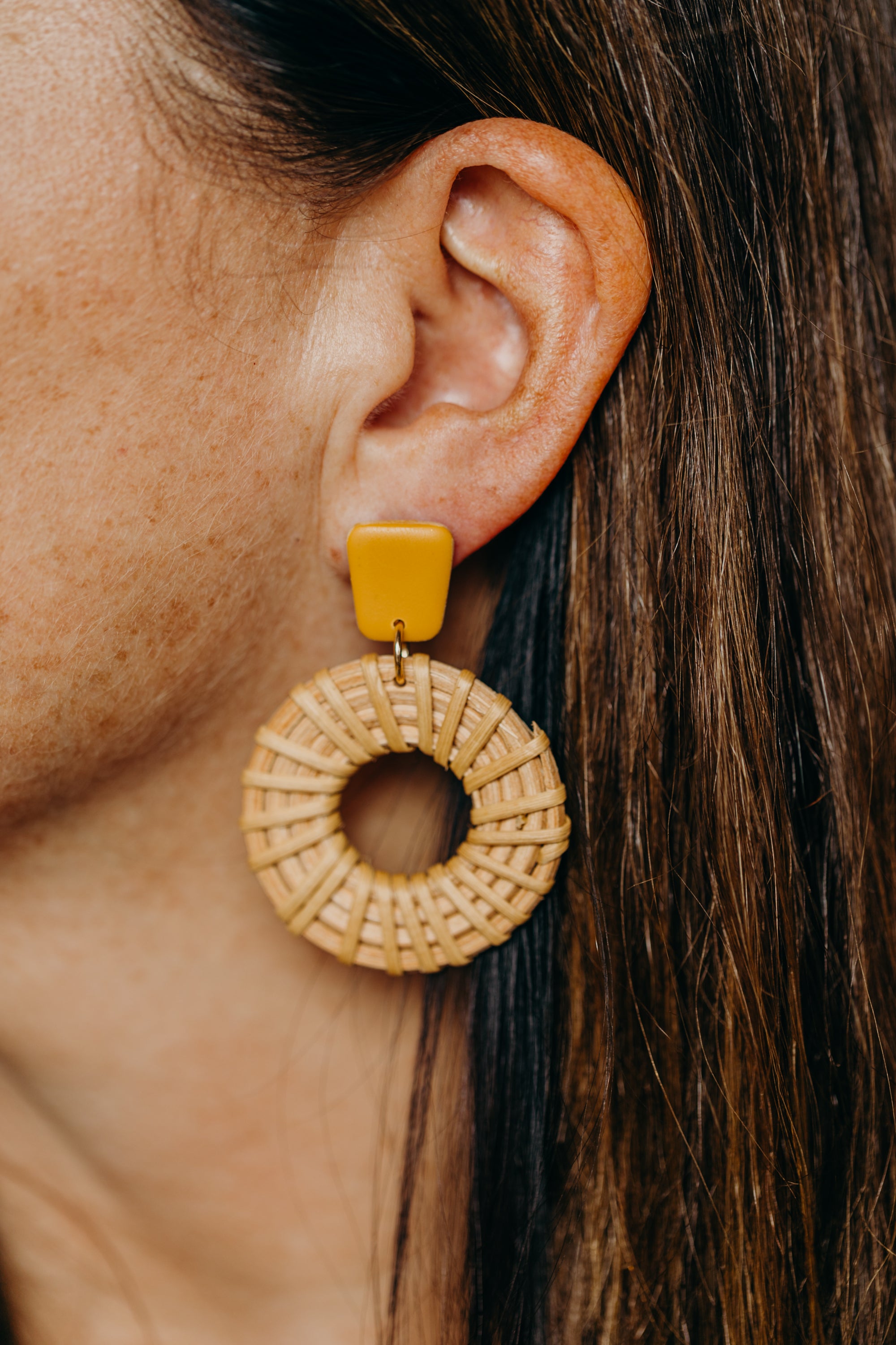 rectangular polymer clay earrings in the color mustard yellow with rattan pendant circle