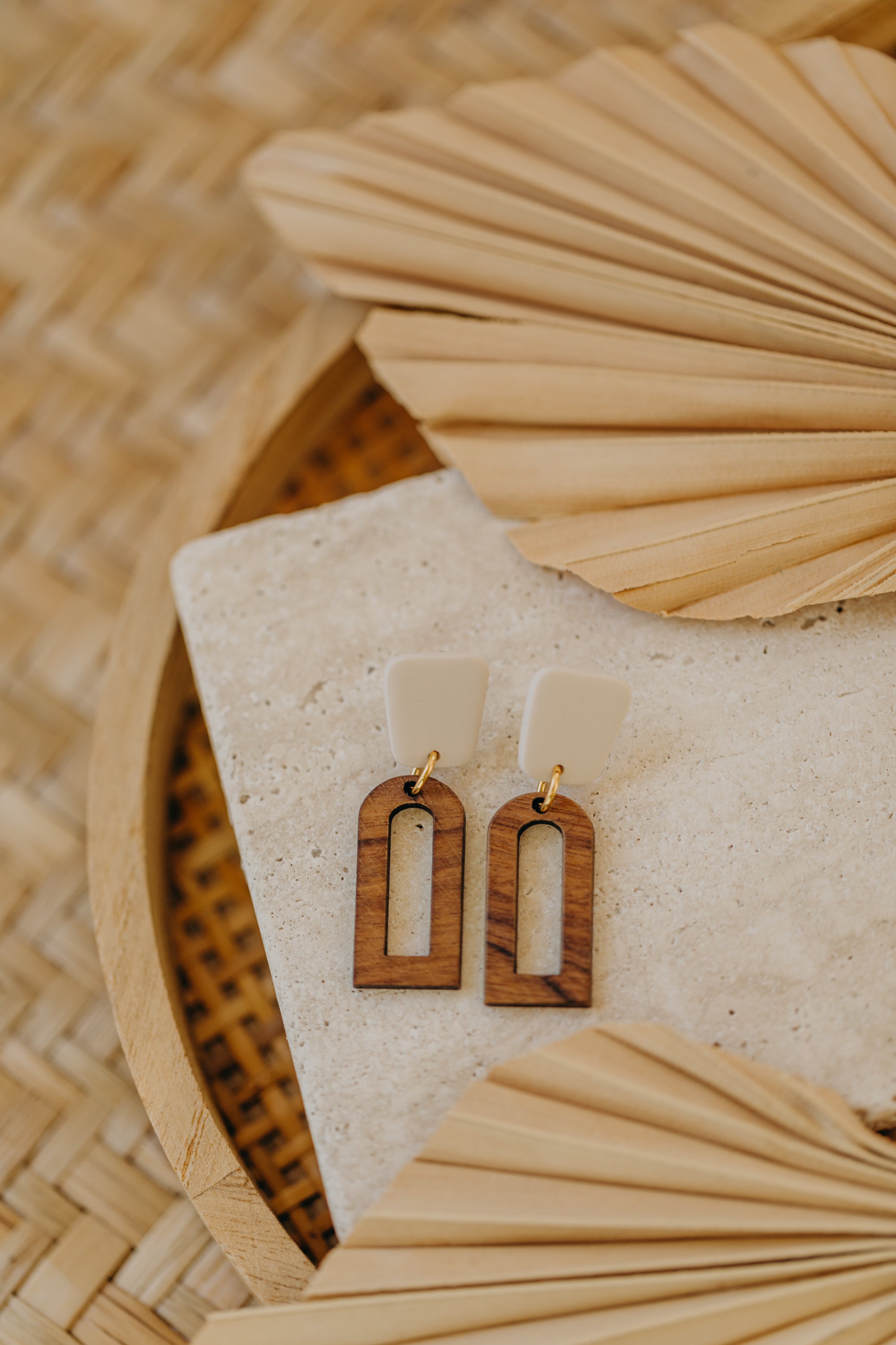 triangular polymer clay earrings in eucalyptus green with rectangular wooden pendant