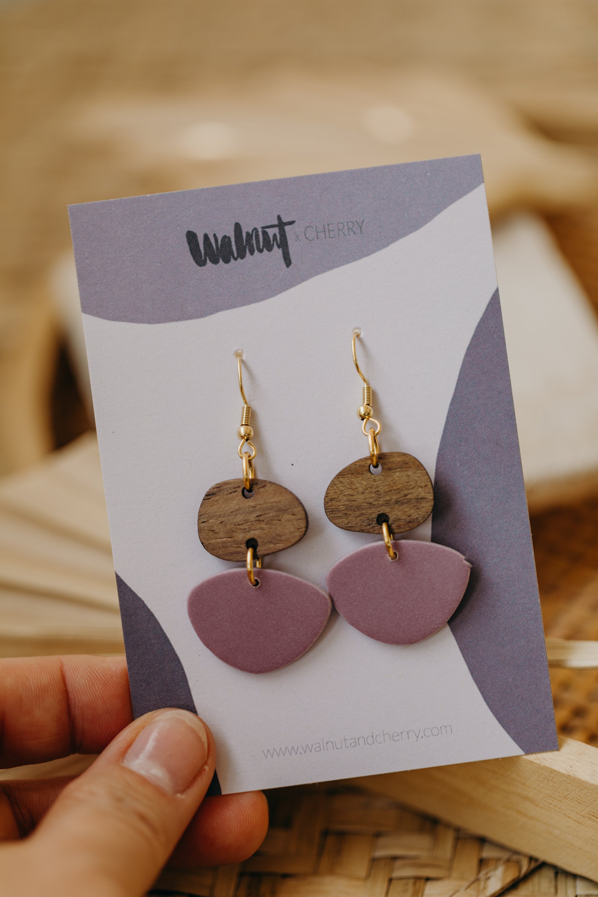 triangular polymer clay earrings in eucalyptus green with rectangular wooden pendant