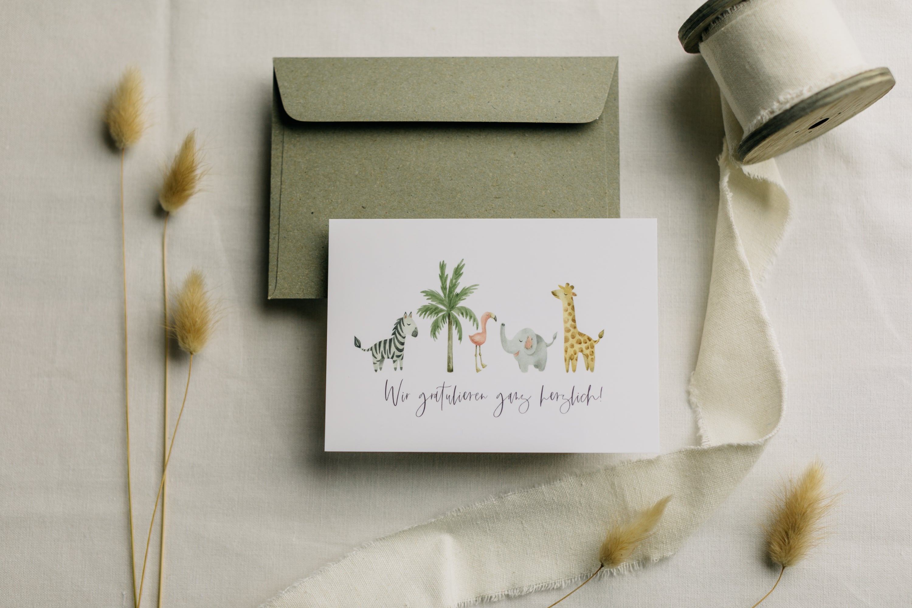 Postkarte afrikanische Tiere mit dem Aufdruck "Wir gratulieren ganz herzlich"