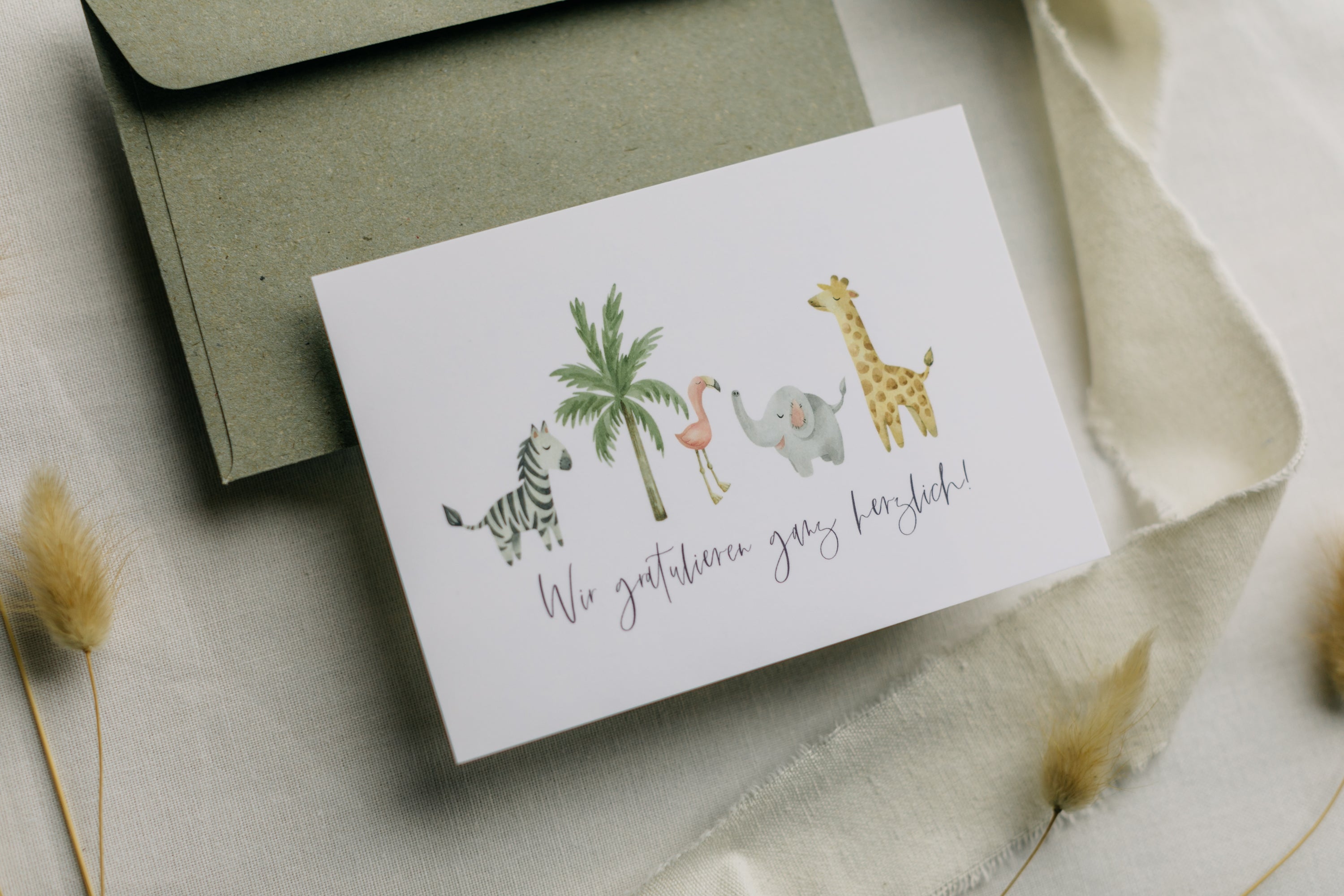 Postkarte afrikanische Tiere mit dem Aufdruck "Wir gratulieren ganz herzlich"