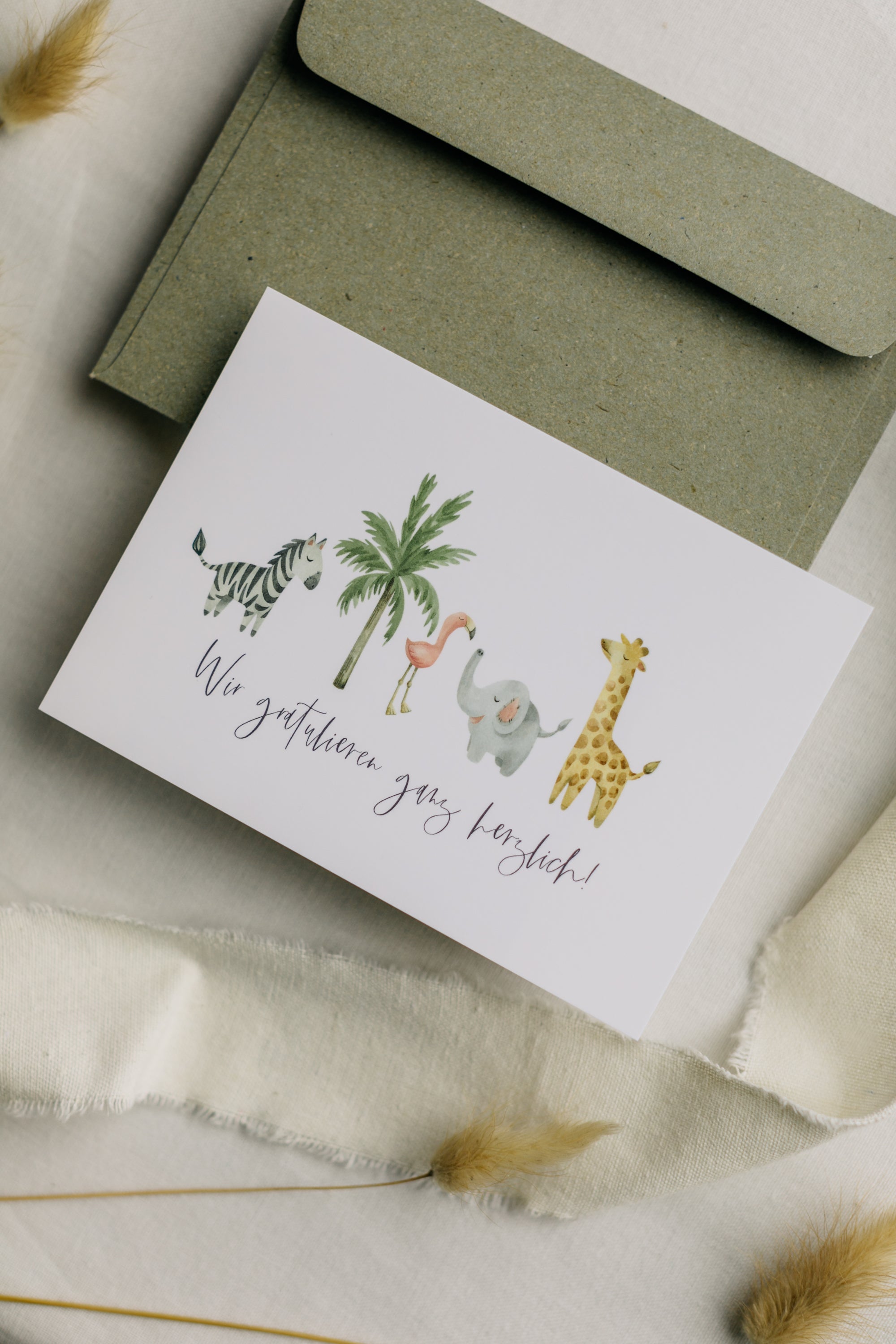 Postkarte afrikanische Tiere mit dem Aufdruck "Wir gratulieren ganz herzlich"
