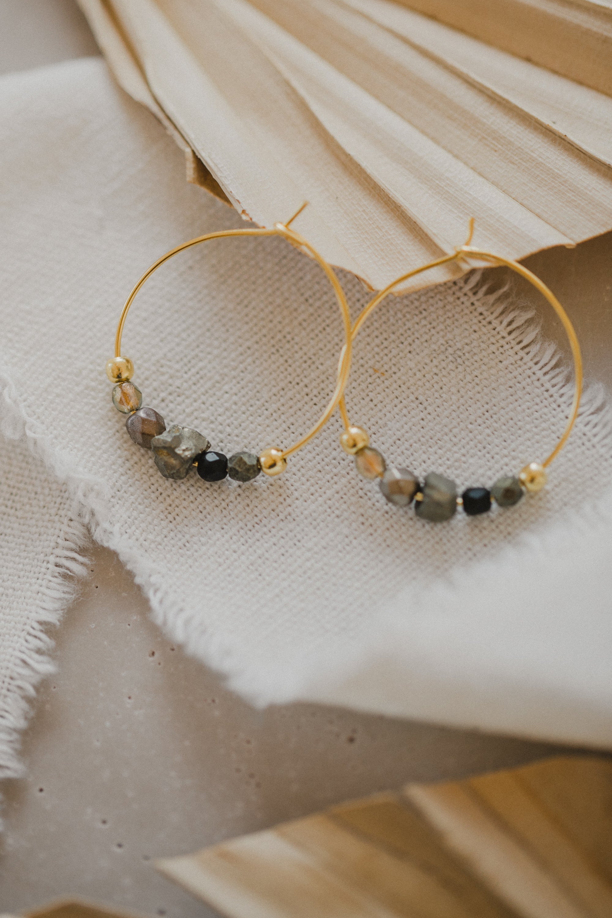 filigree creole made of titanium with pyrite gemstones