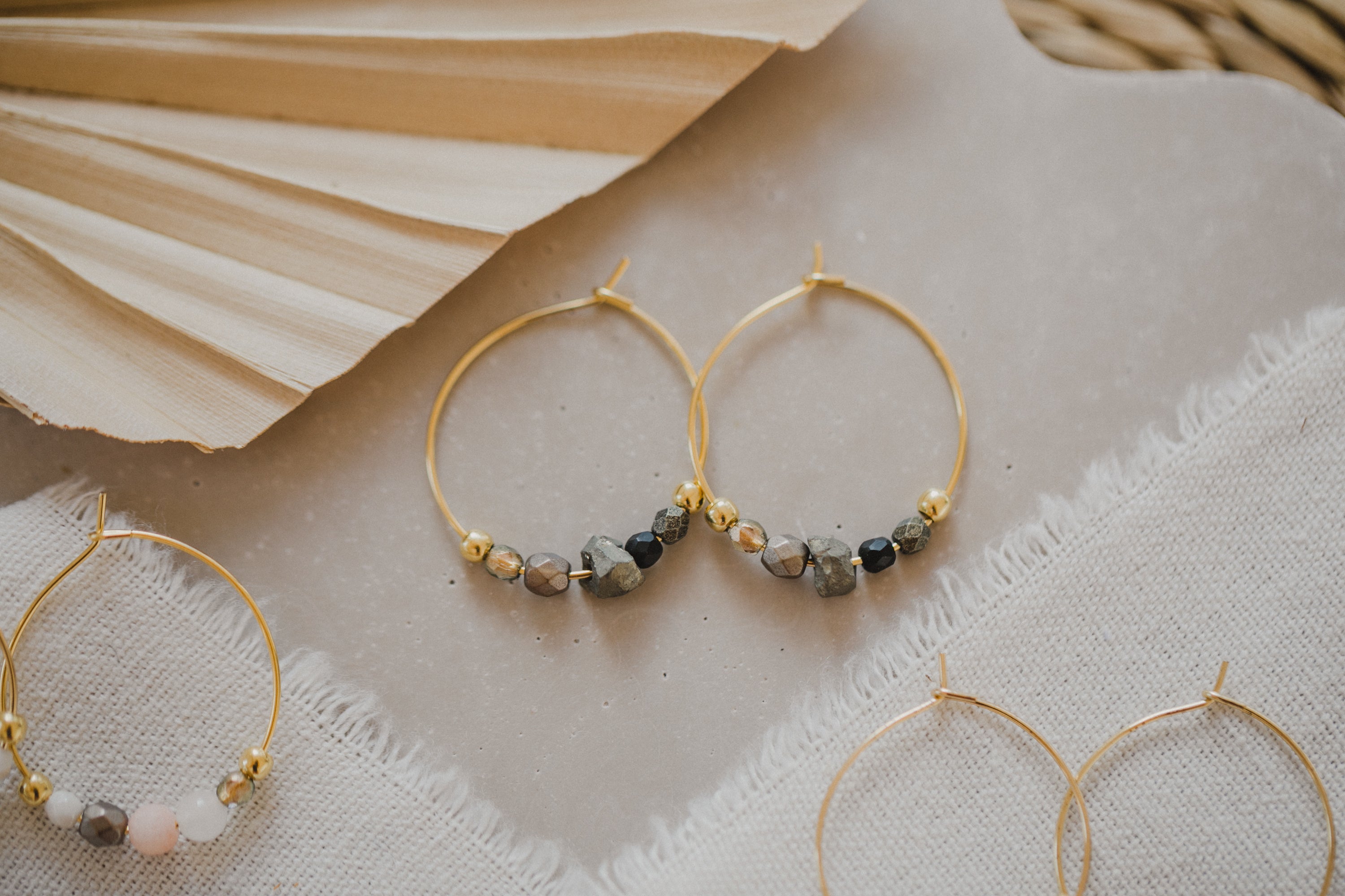 filigree creole made of titanium with pyrite gemstones