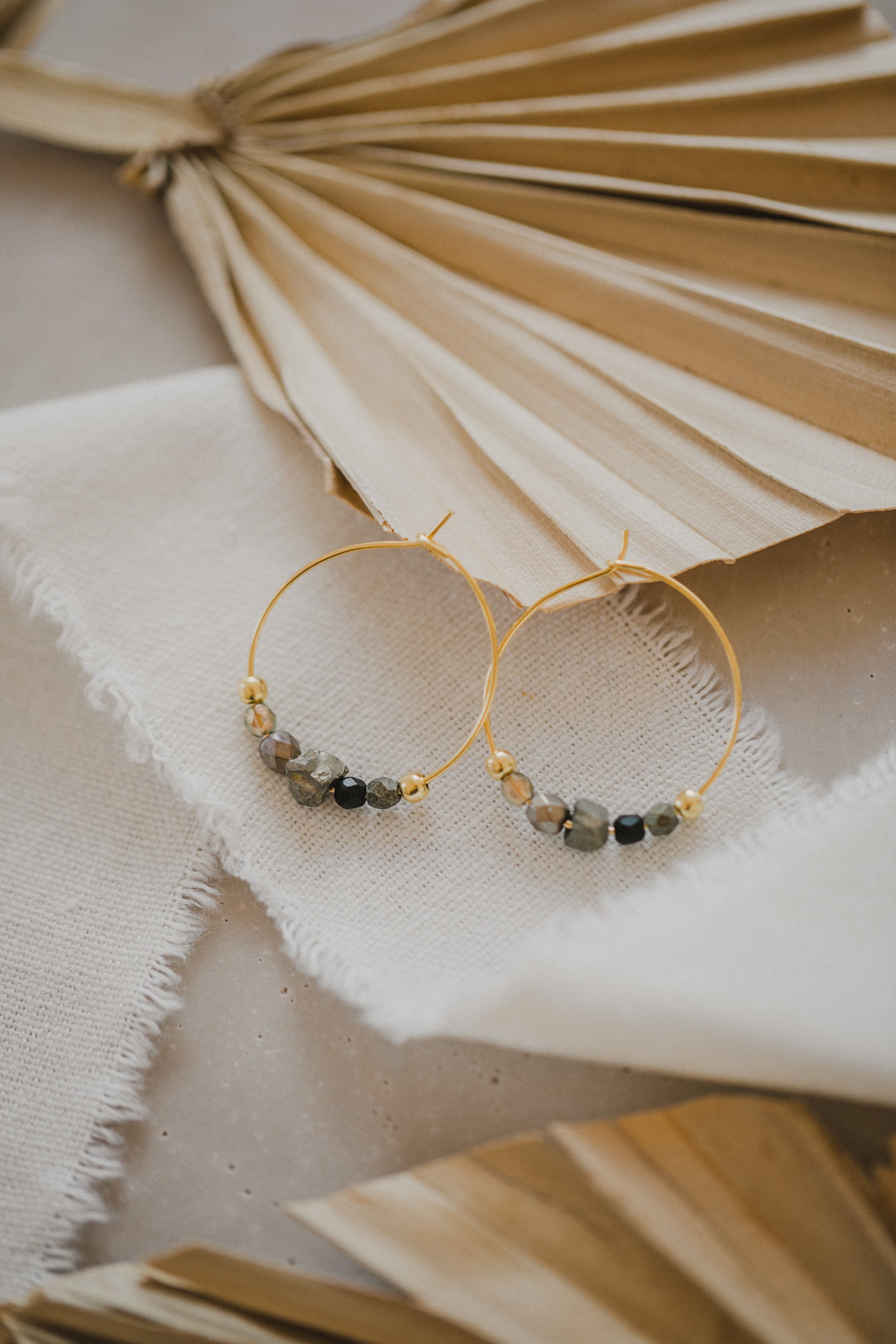 filigree creole made of titanium with pyrite gemstones