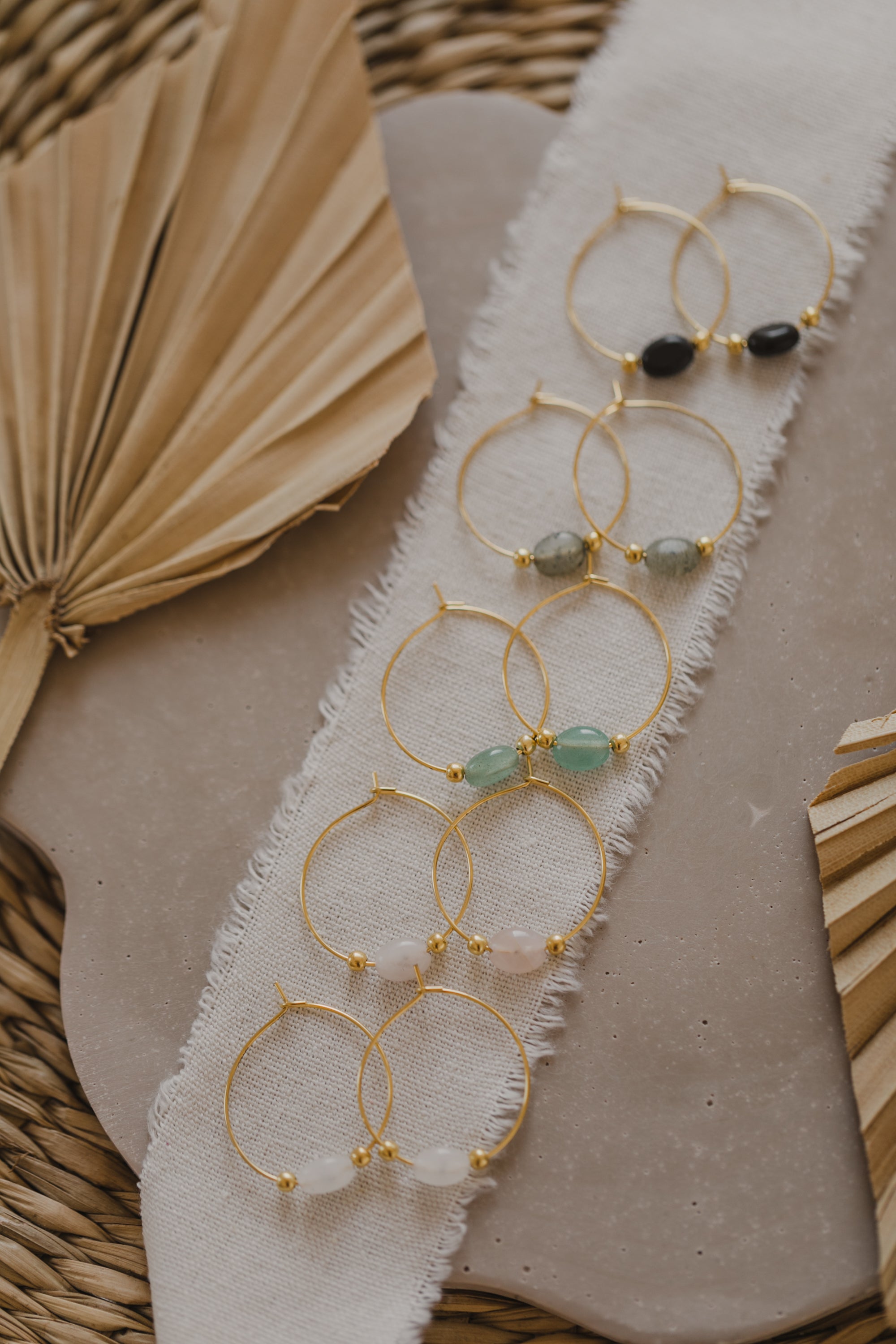 filigree creole made of titanium with oval black obsidian gemstone