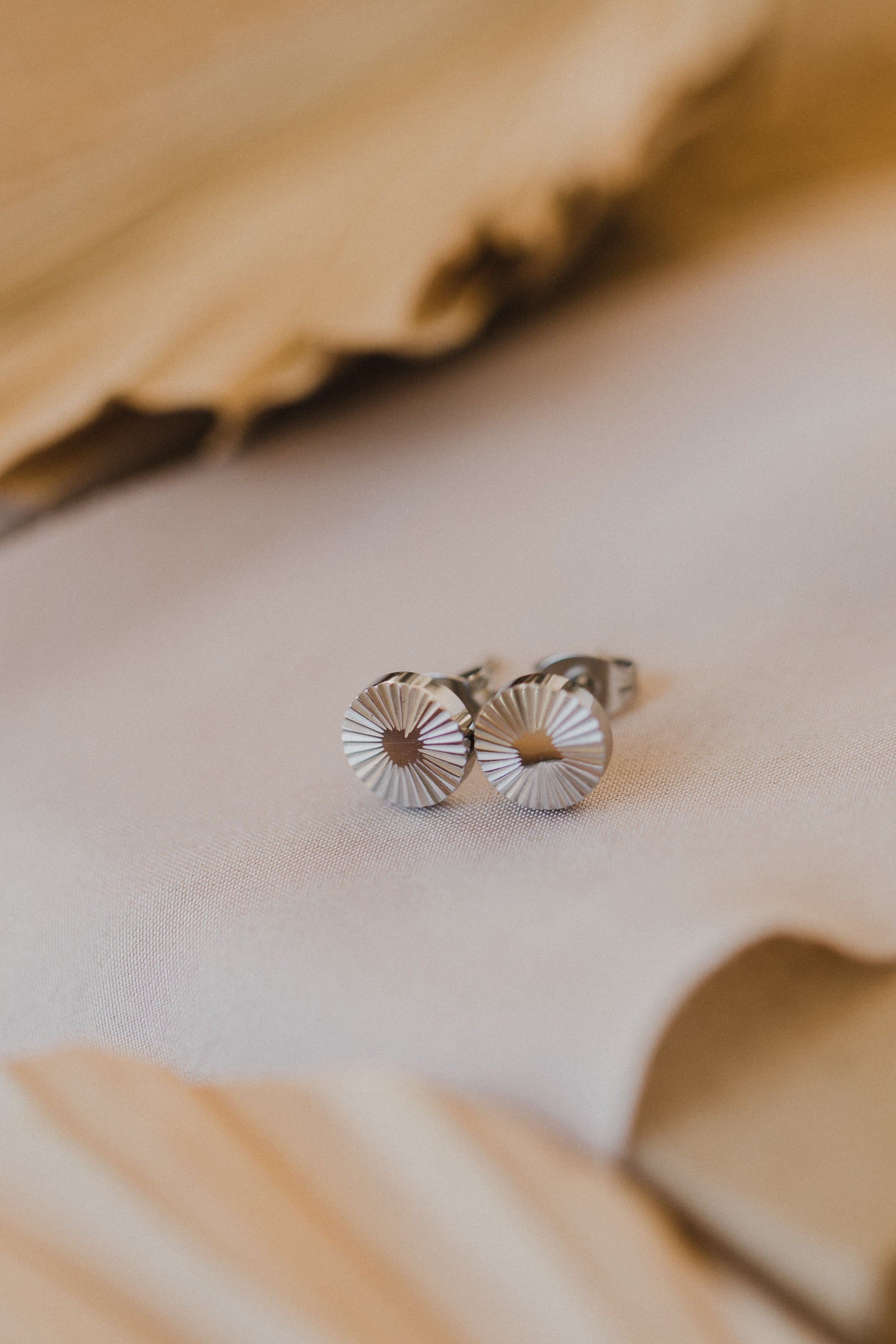 round titanium stud earrings with pattern