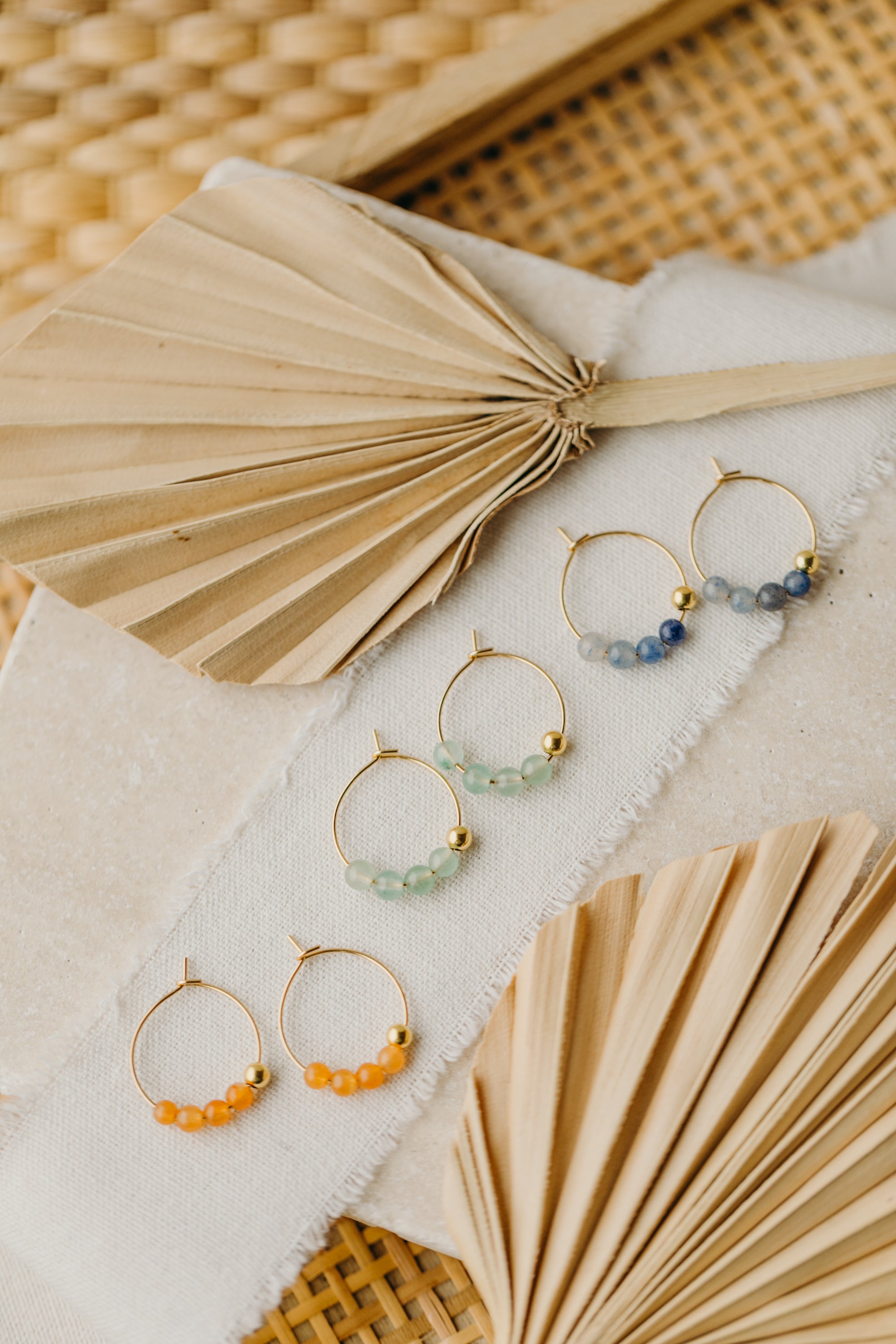 filigree creole made of titanium with green aventurine beads