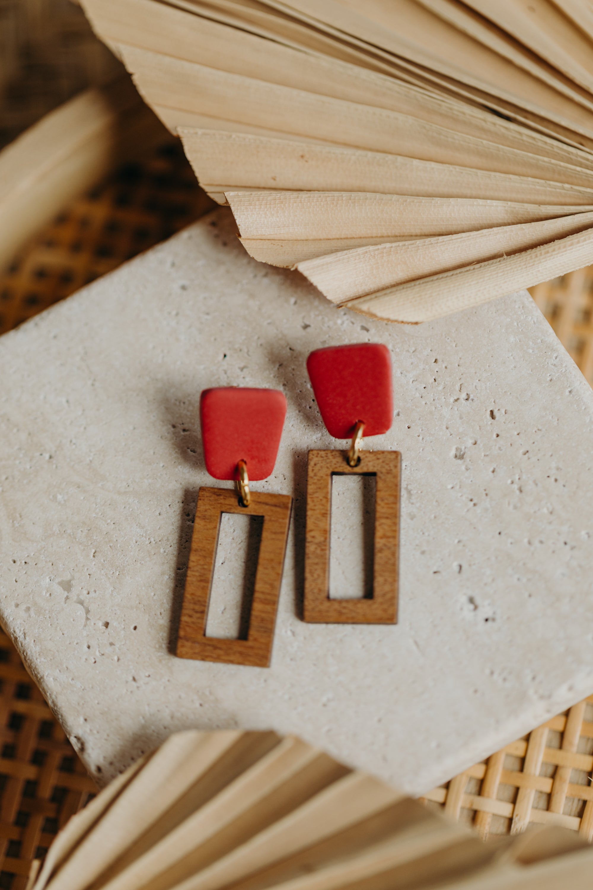 triangular polymer clay earrings in eucalyptus green with rectangular wooden pendant