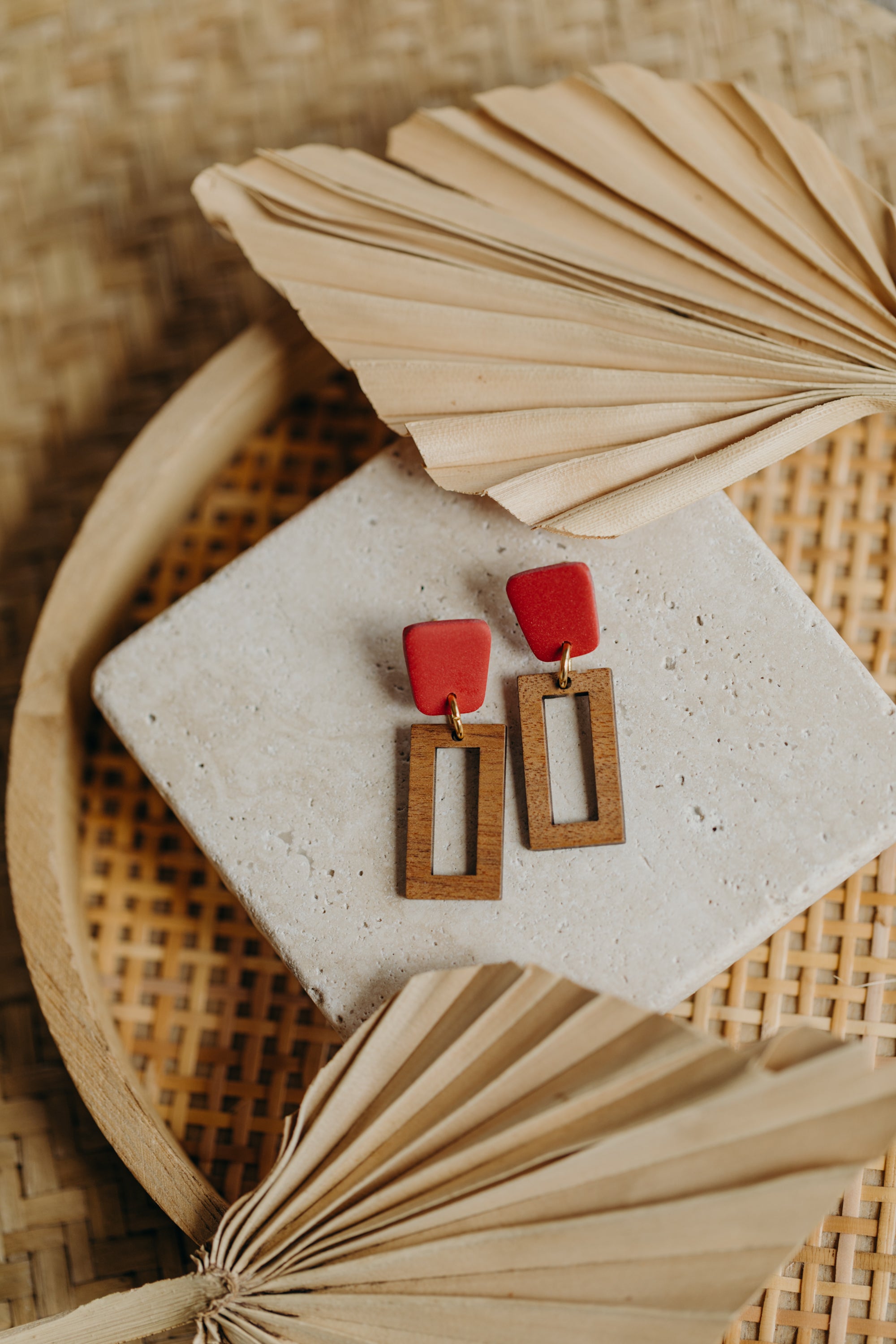 triangular polymer clay earrings in eucalyptus green with rectangular wooden pendant