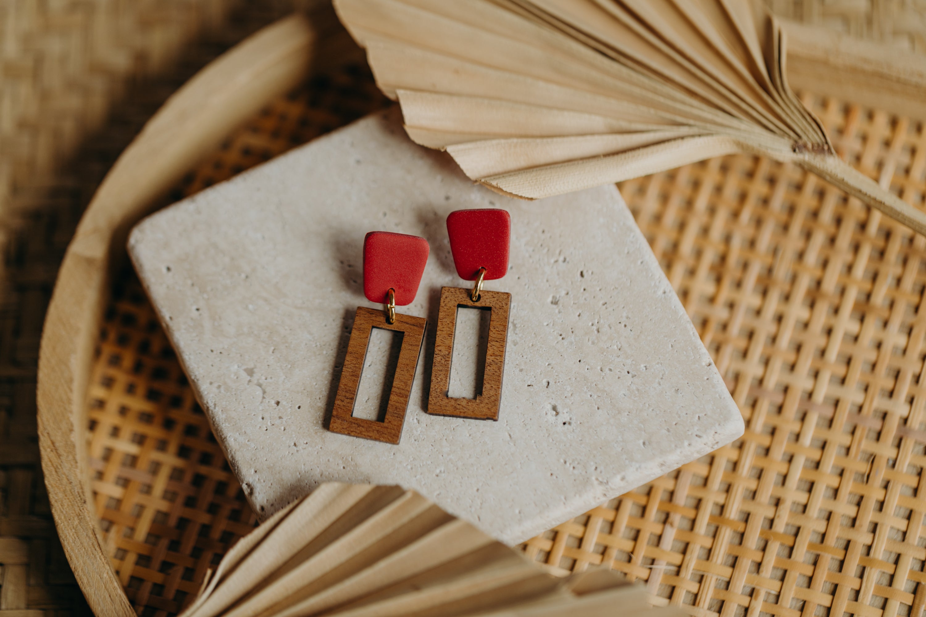 triangular polymer clay earrings in eucalyptus green with rectangular wooden pendant