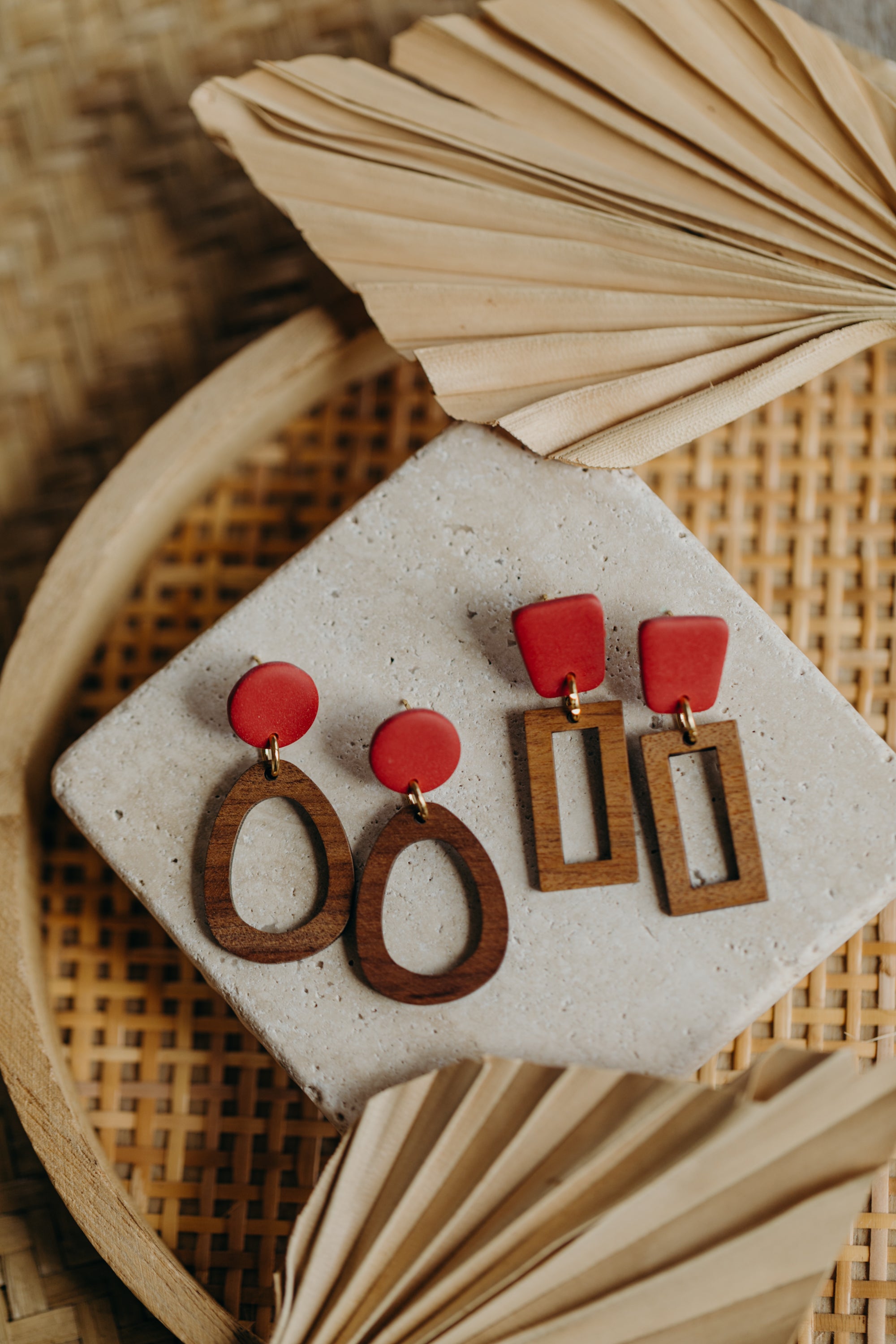 triangular polymer clay earrings in eucalyptus green with rectangular wooden pendant
