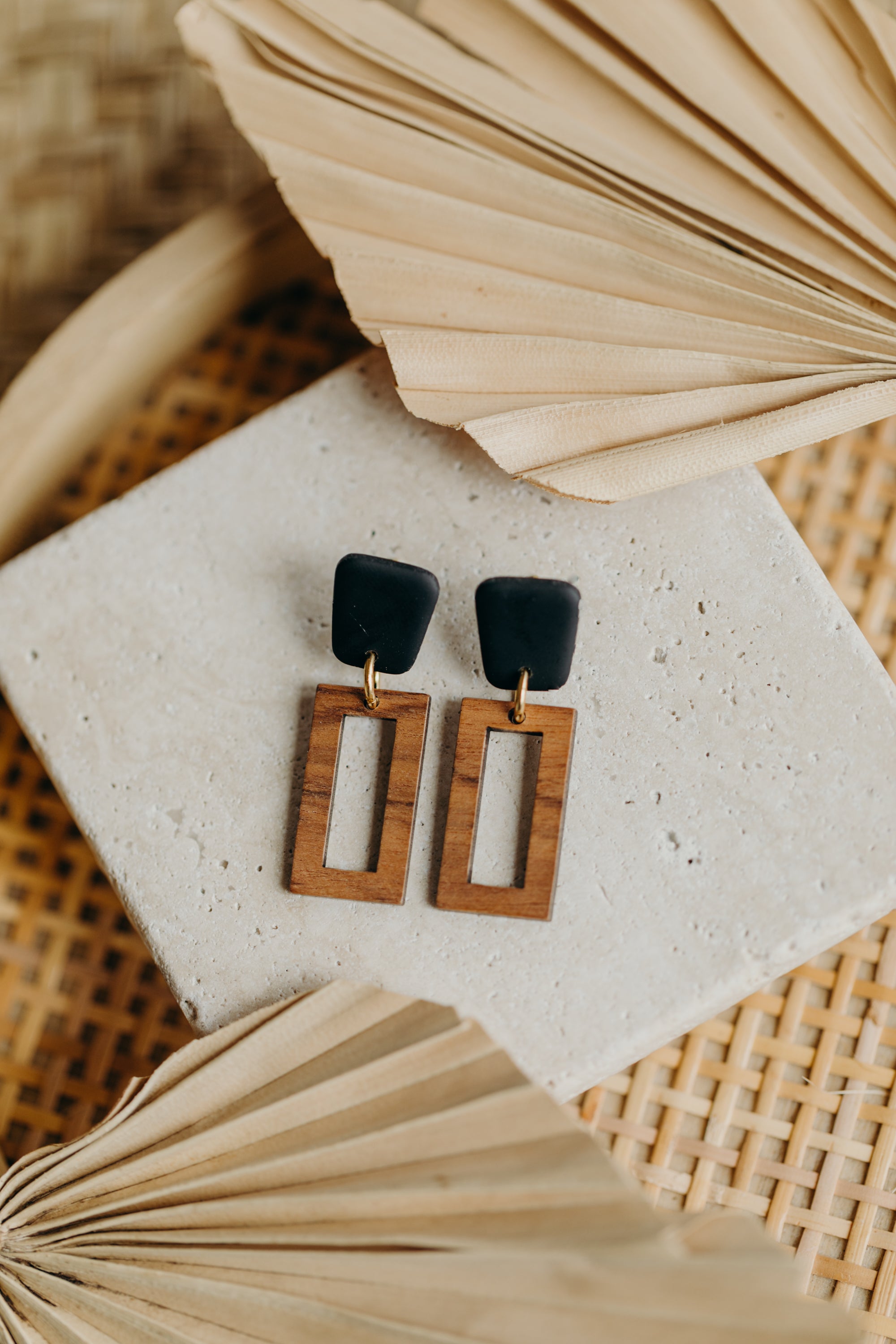 triangular polymer clay earrings in eucalyptus green with rectangular wooden pendant
