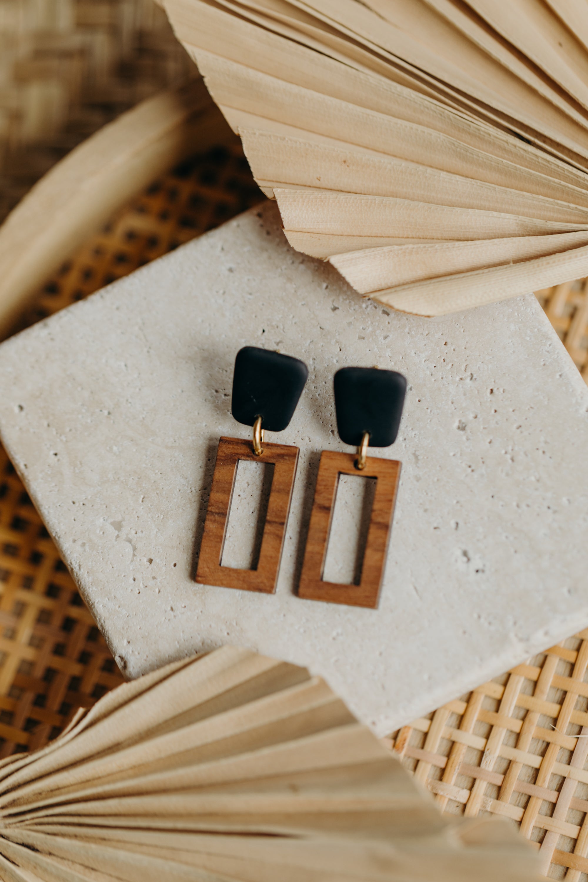 triangular polymer clay earrings in eucalyptus green with rectangular wooden pendant