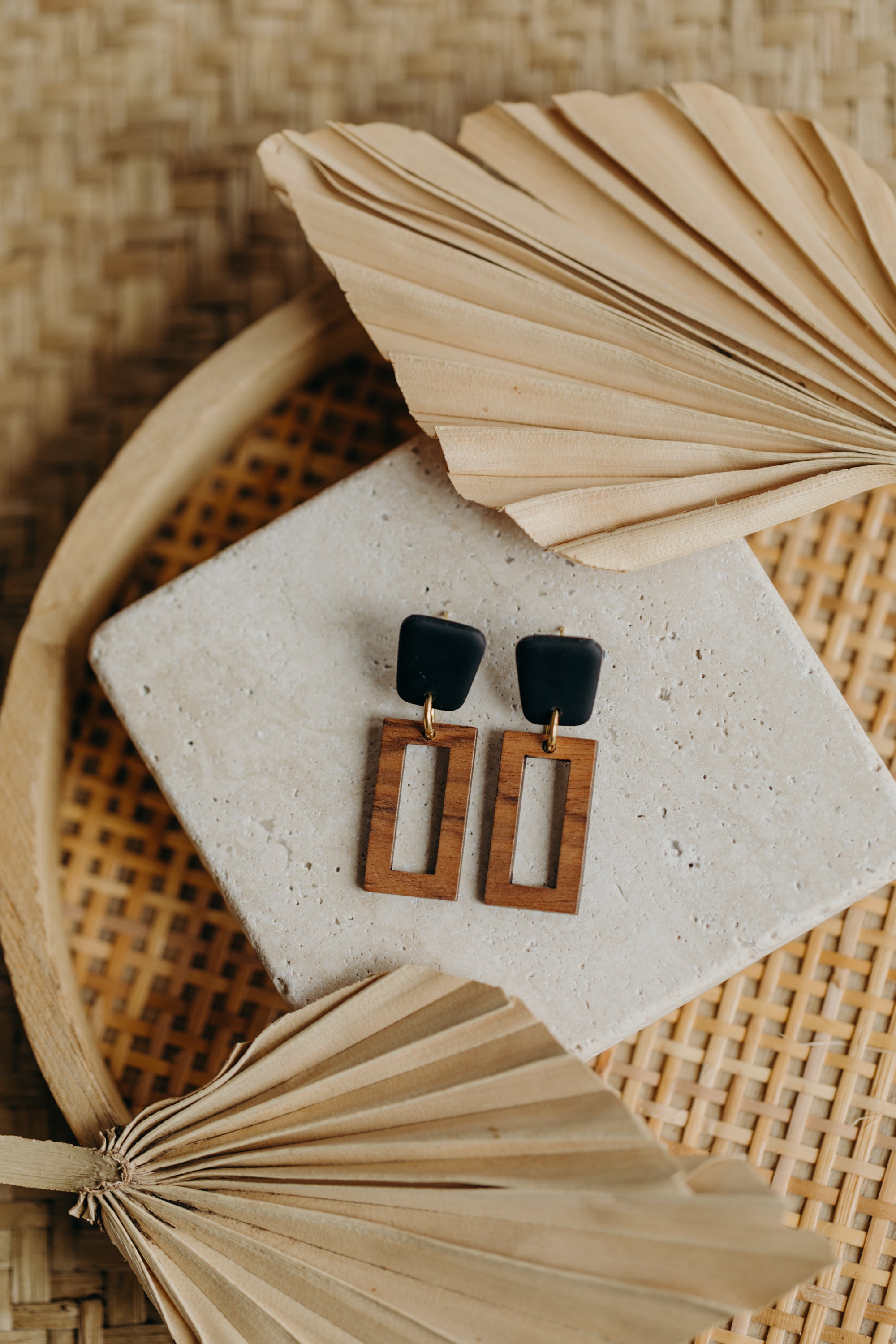 triangular polymer clay earrings in eucalyptus green with rectangular wooden pendant