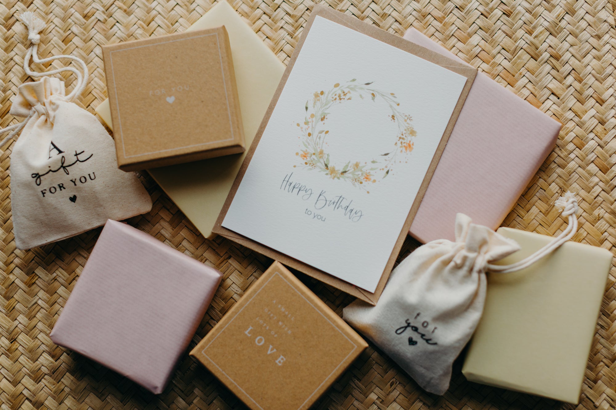 Gift box kraft paper with print "A gift for you" and white snowflakes