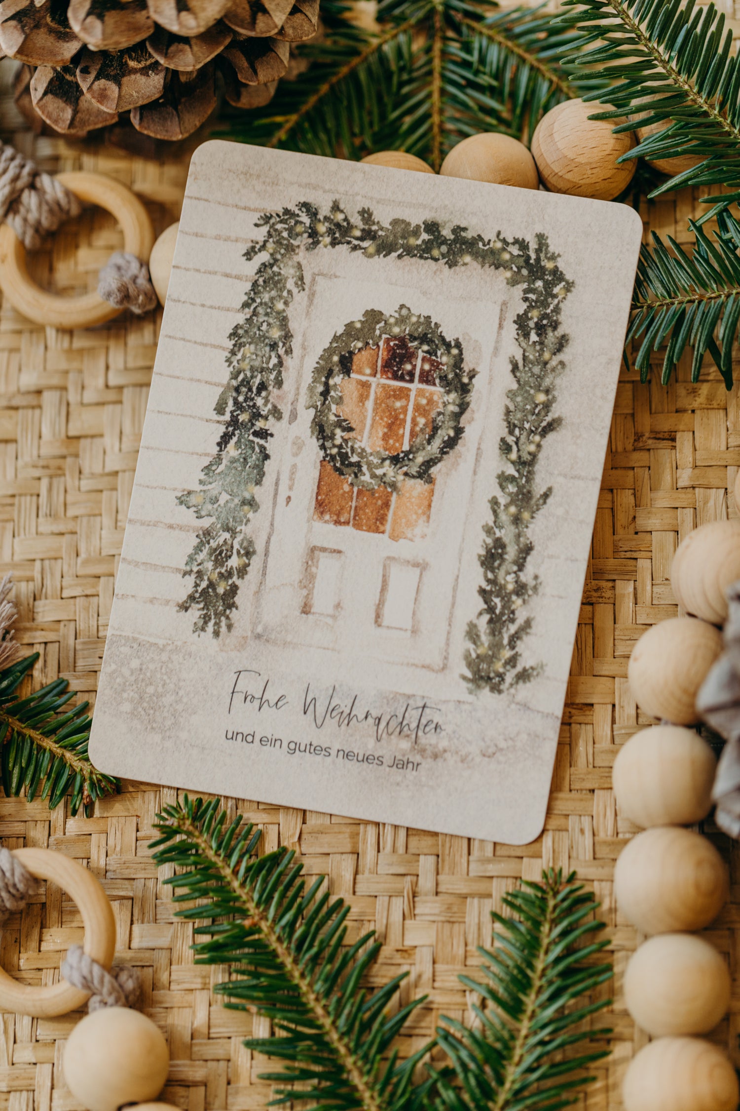 Christmas postcard front door with green garland