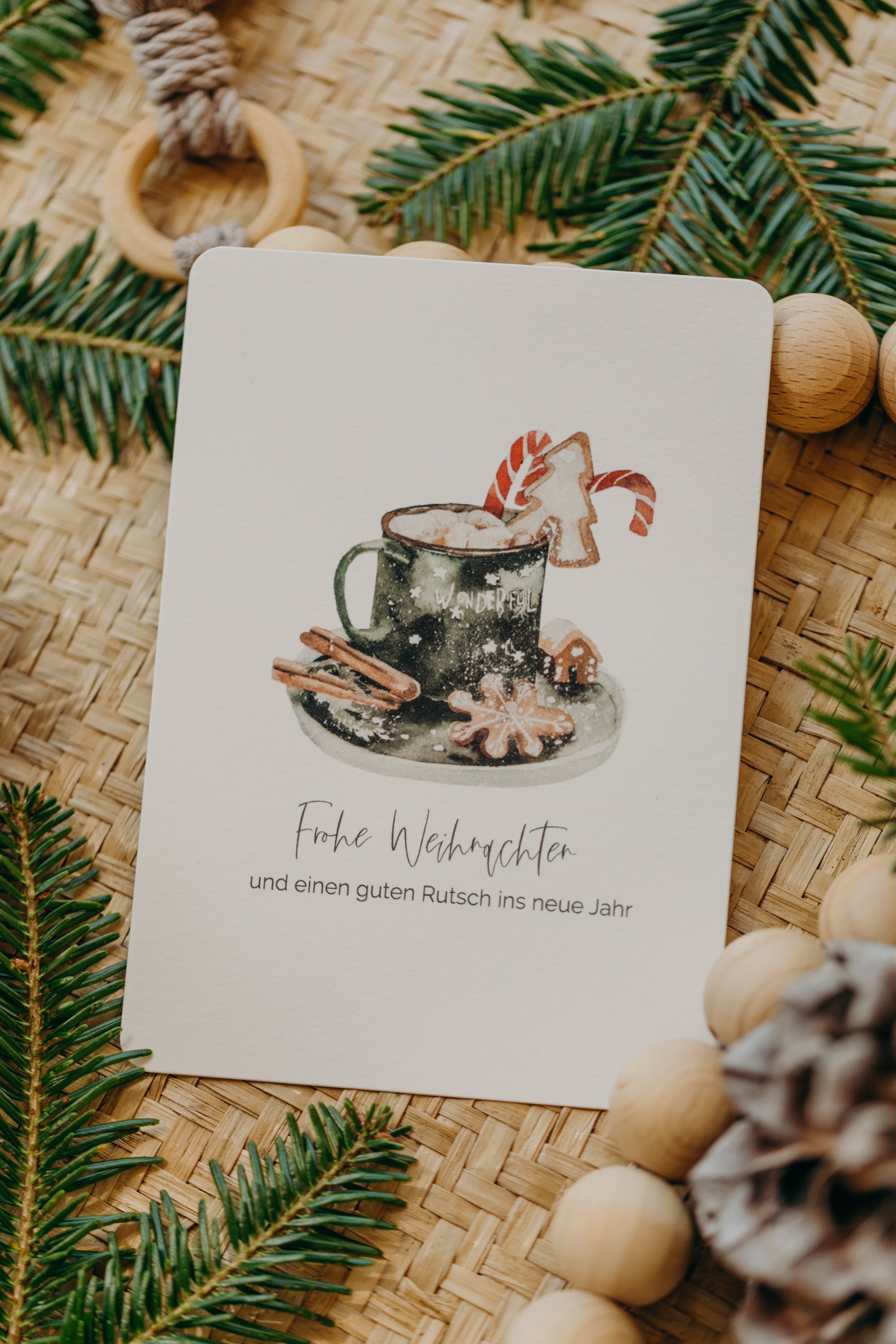 Christmas postcard cup with cookies and cinnamon sticks