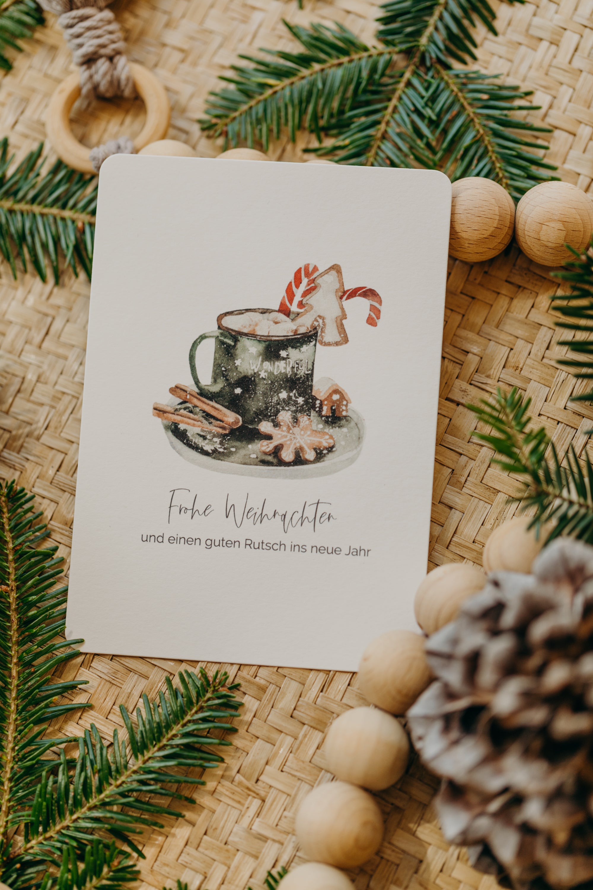 Christmas postcard cup with cookies and cinnamon sticks