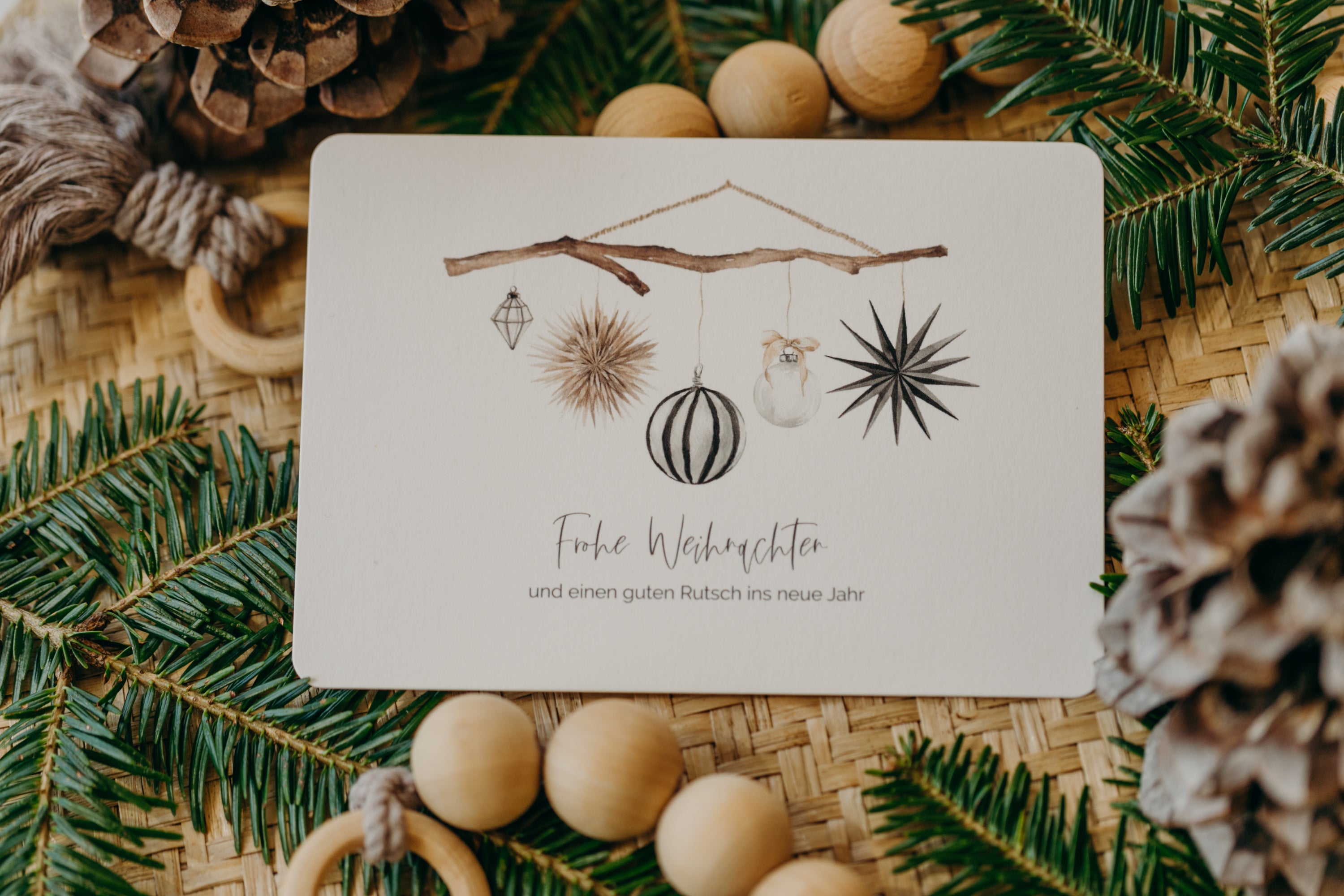 Christmas postcard branch with black and white Christmas motifs
