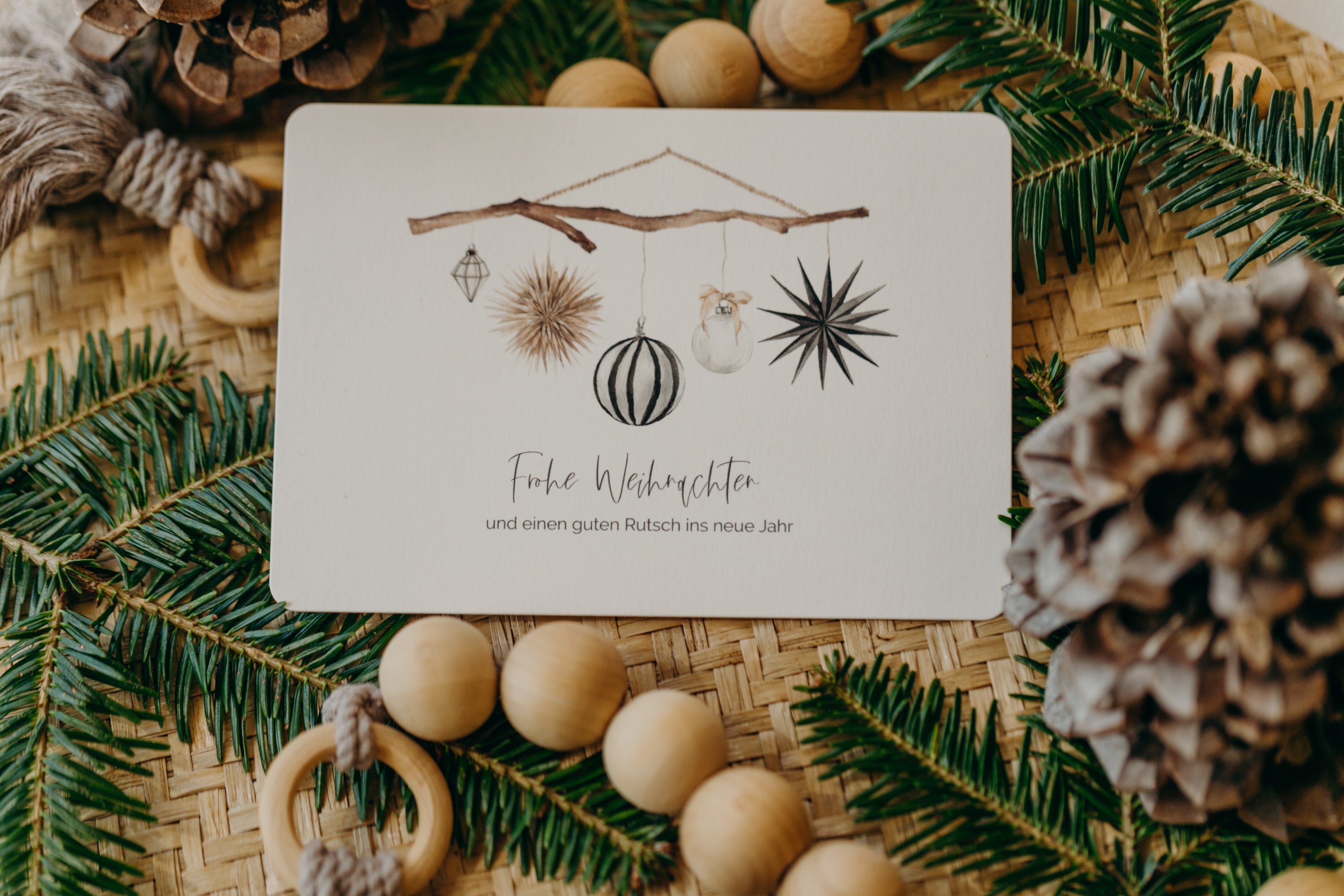 Christmas postcard branch with black and white Christmas motifs