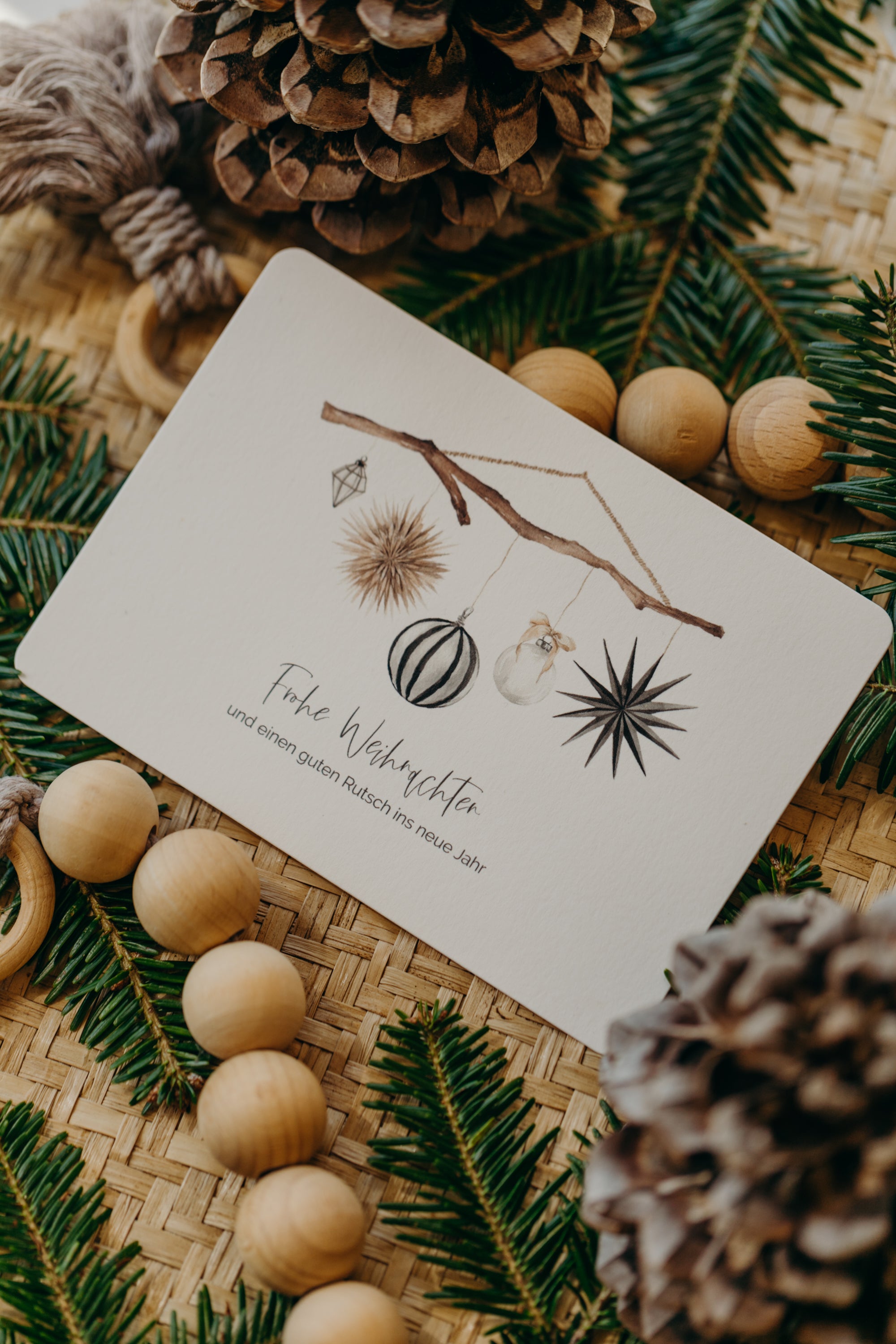 Christmas postcard branch with black and white Christmas motifs