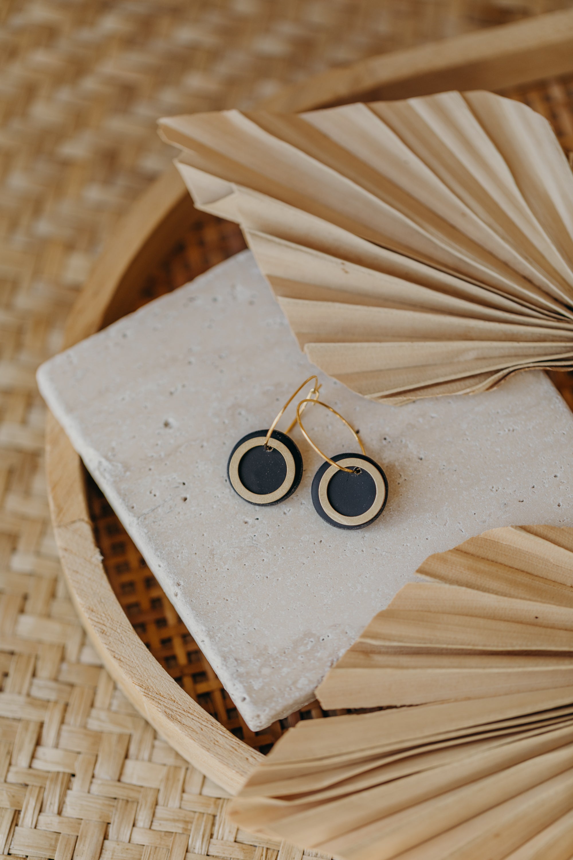 Hoop earrings with round polymer clay pendant and leaf