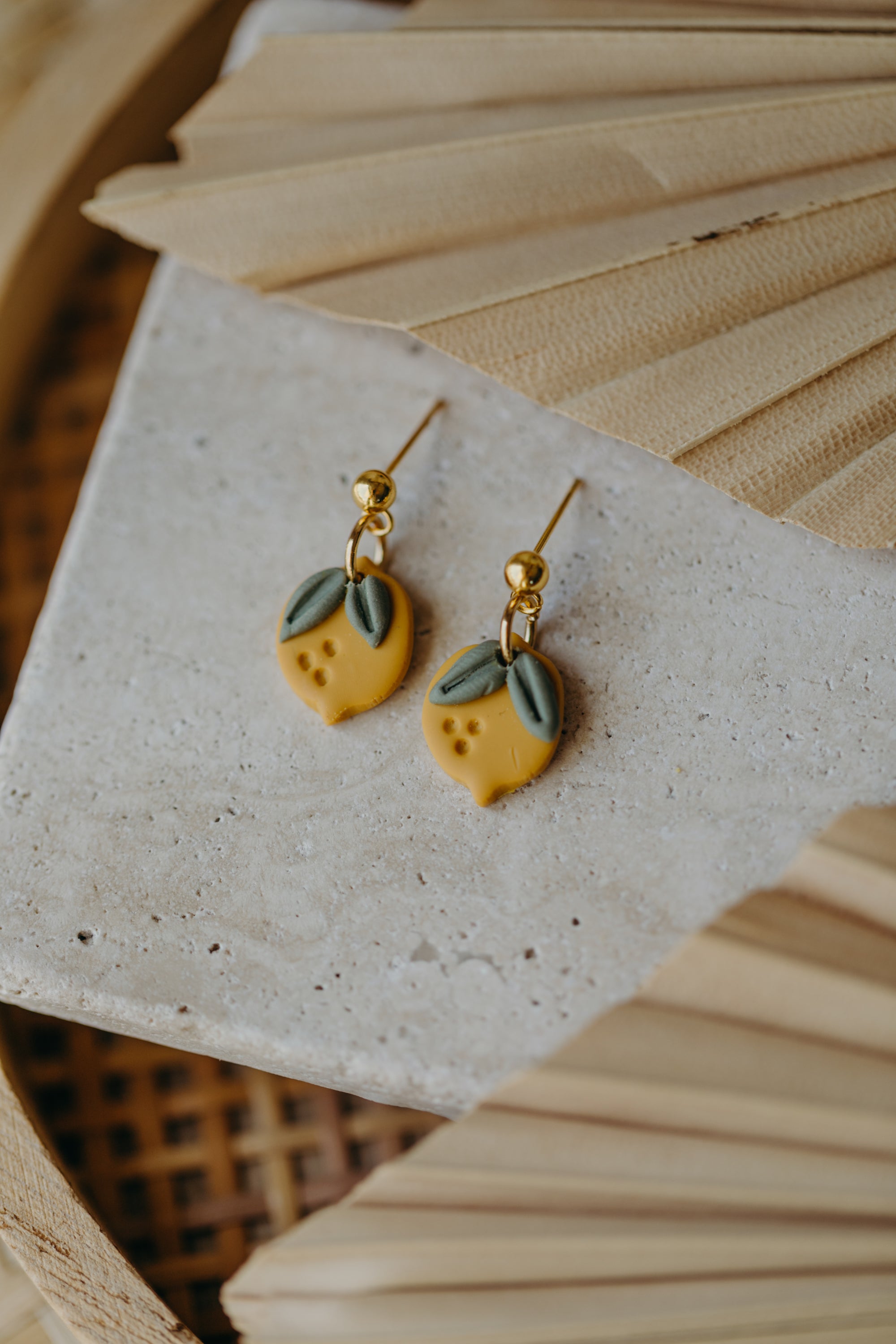 Hoop earrings with round polymer clay pendant and leaf