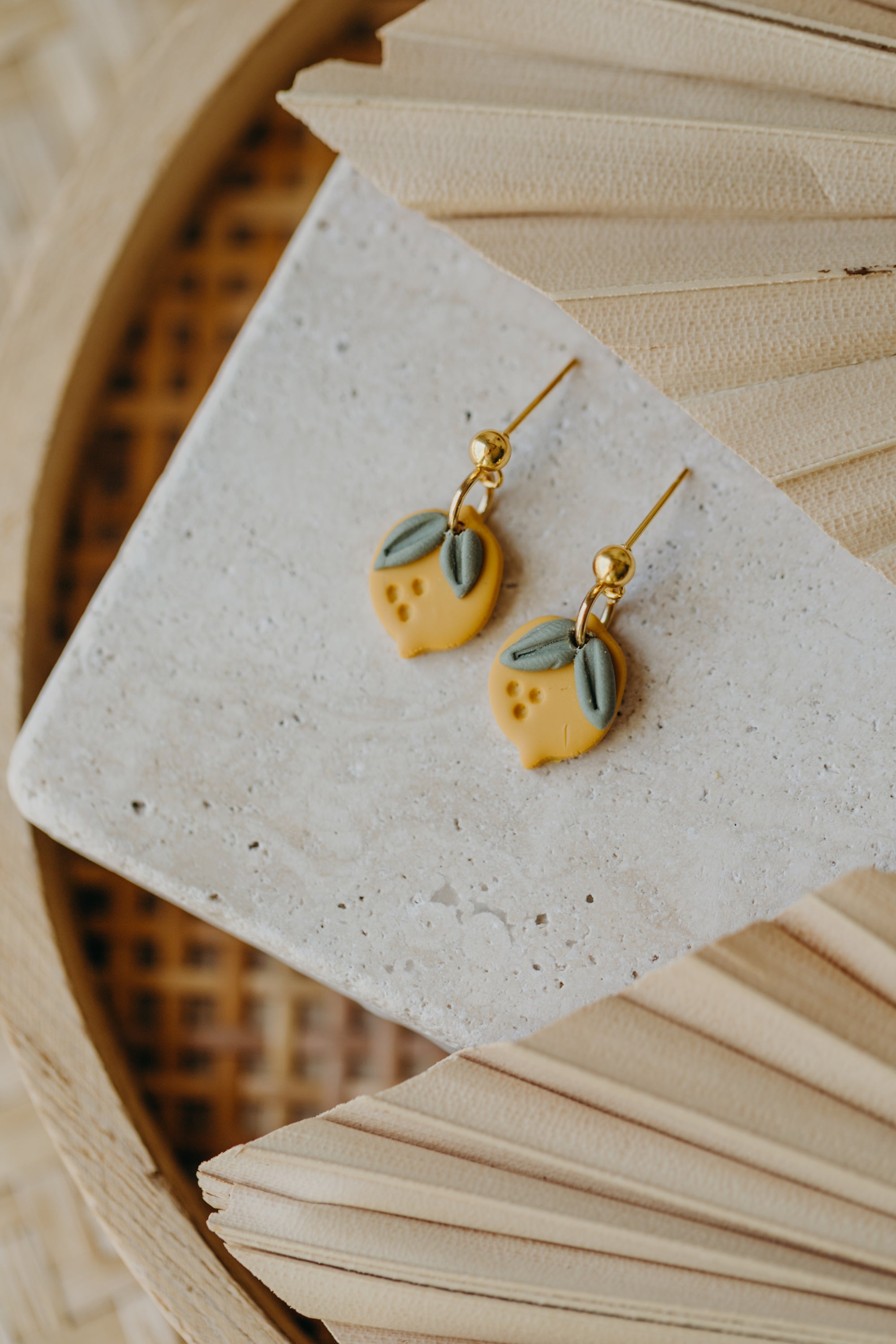 Hoop earrings with round polymer clay pendant and leaf