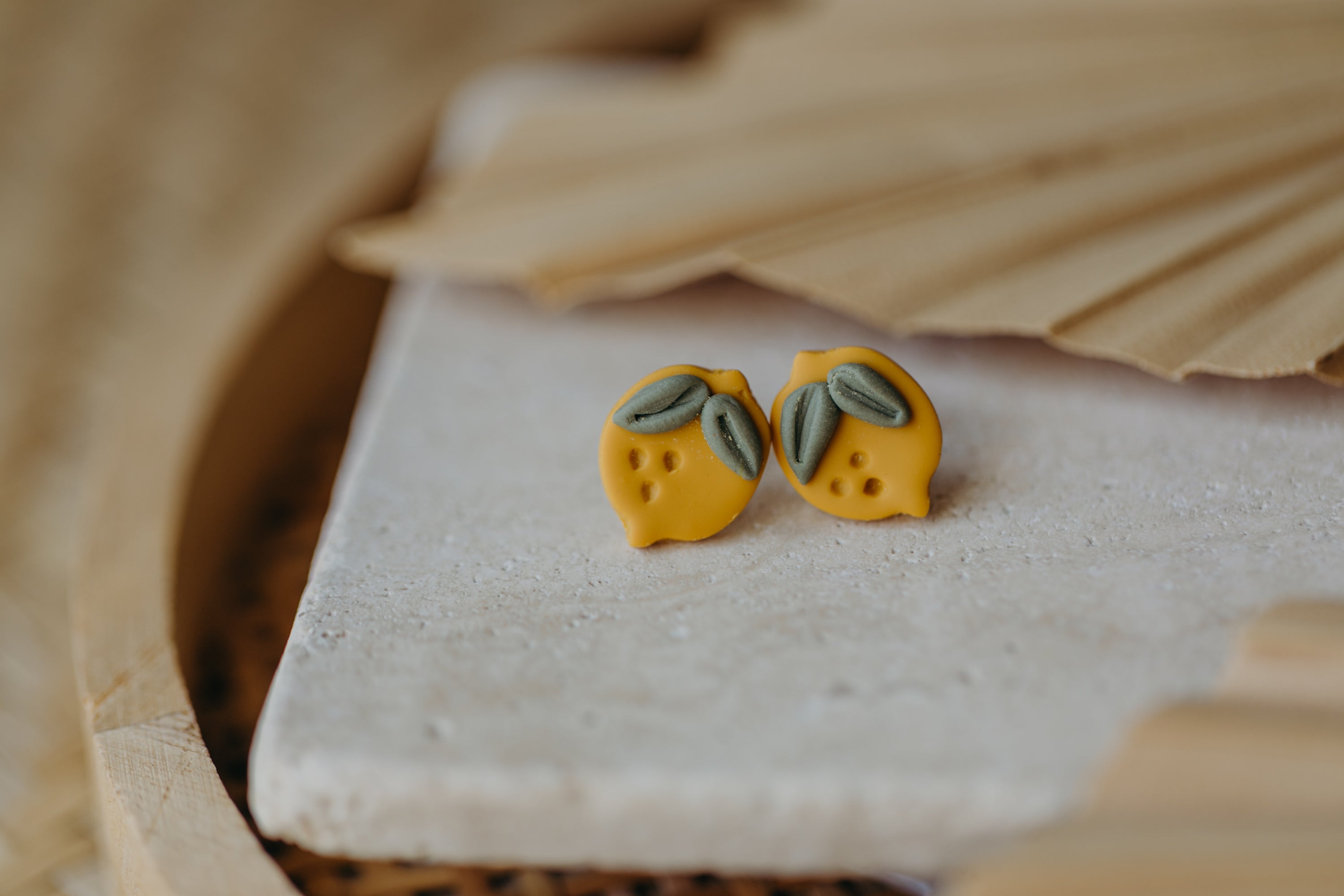 Hoop earrings with round polymer clay pendant and leaf