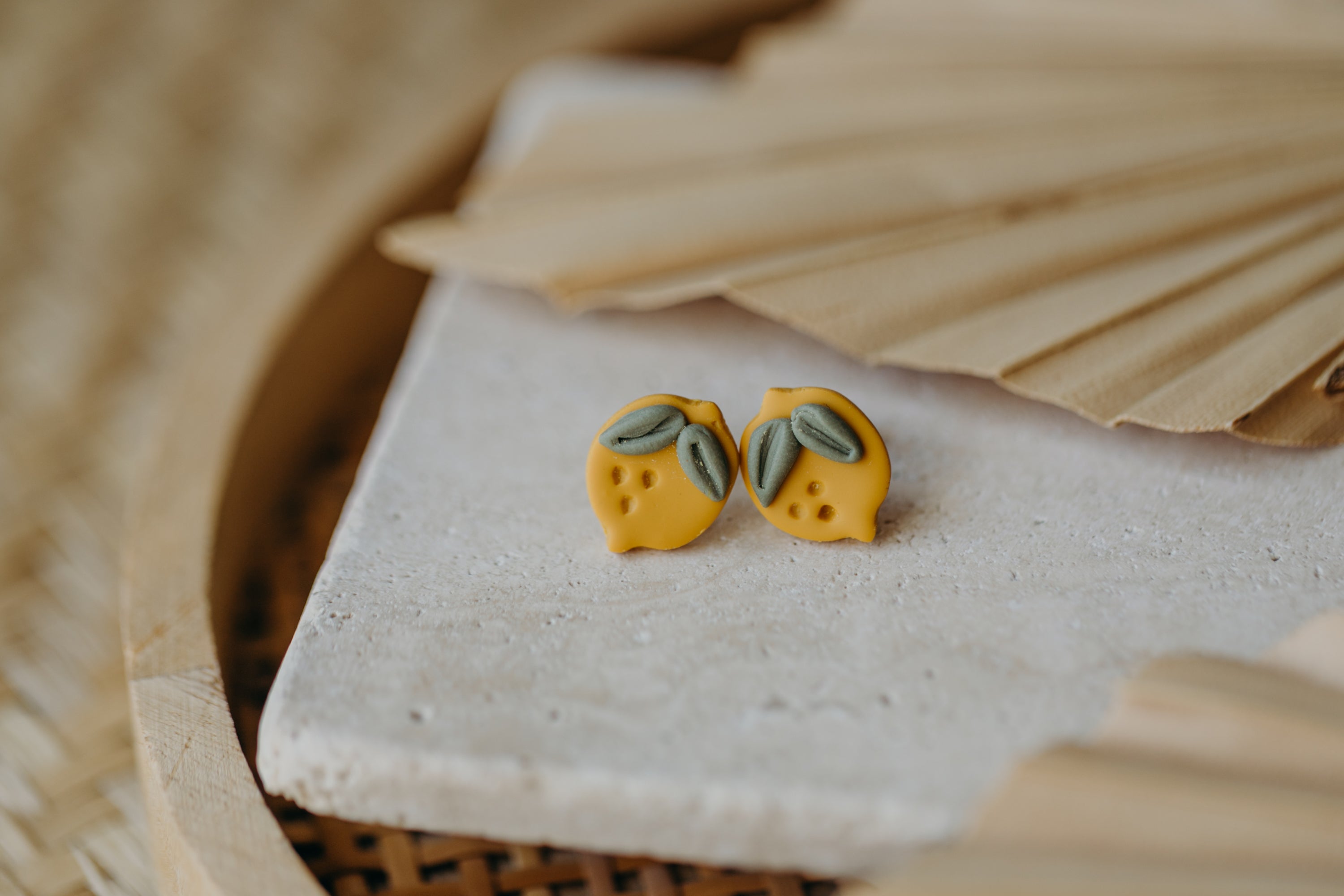 Hoop earrings with round polymer clay pendant and leaf