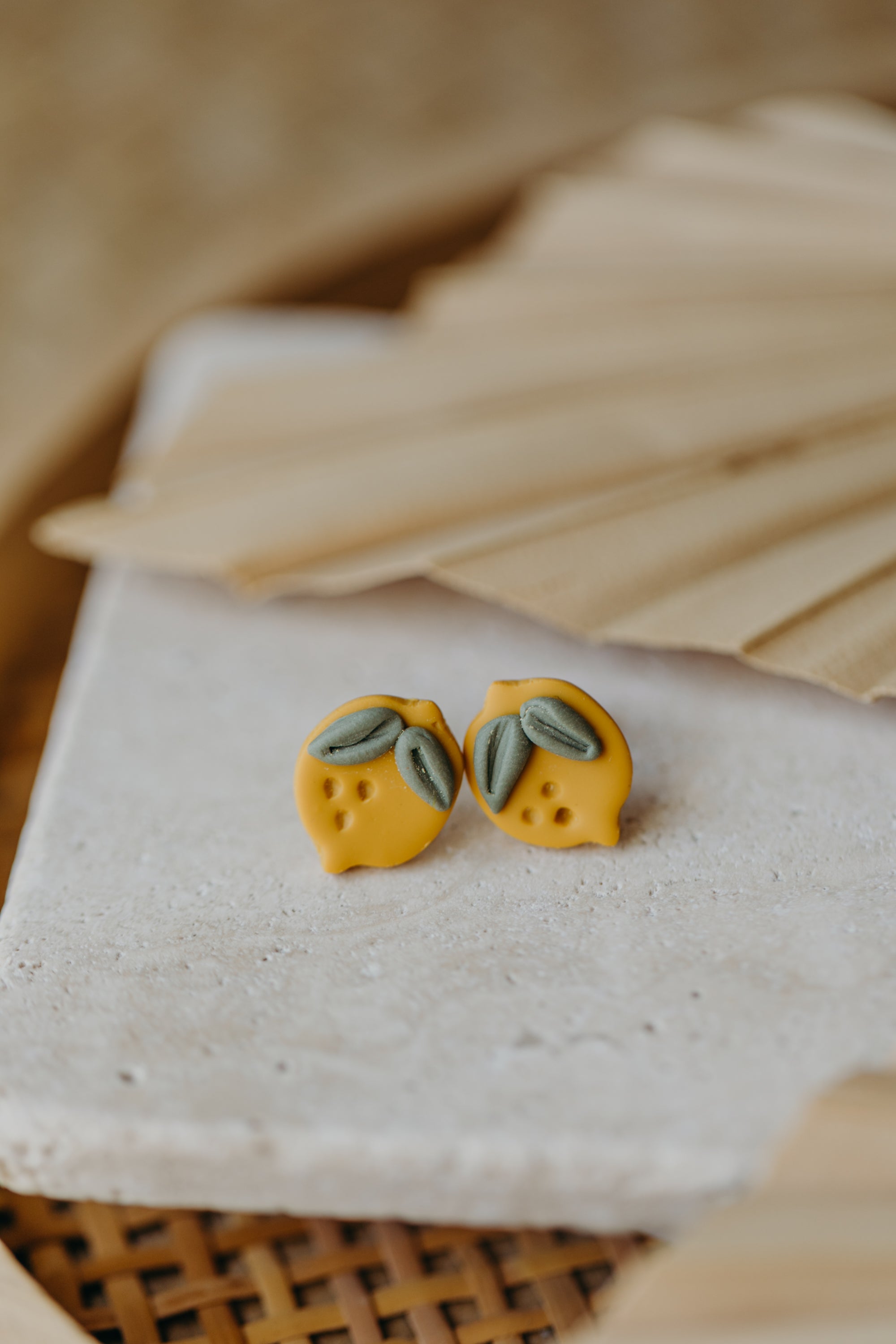 Hoop earrings with round polymer clay pendant and leaf