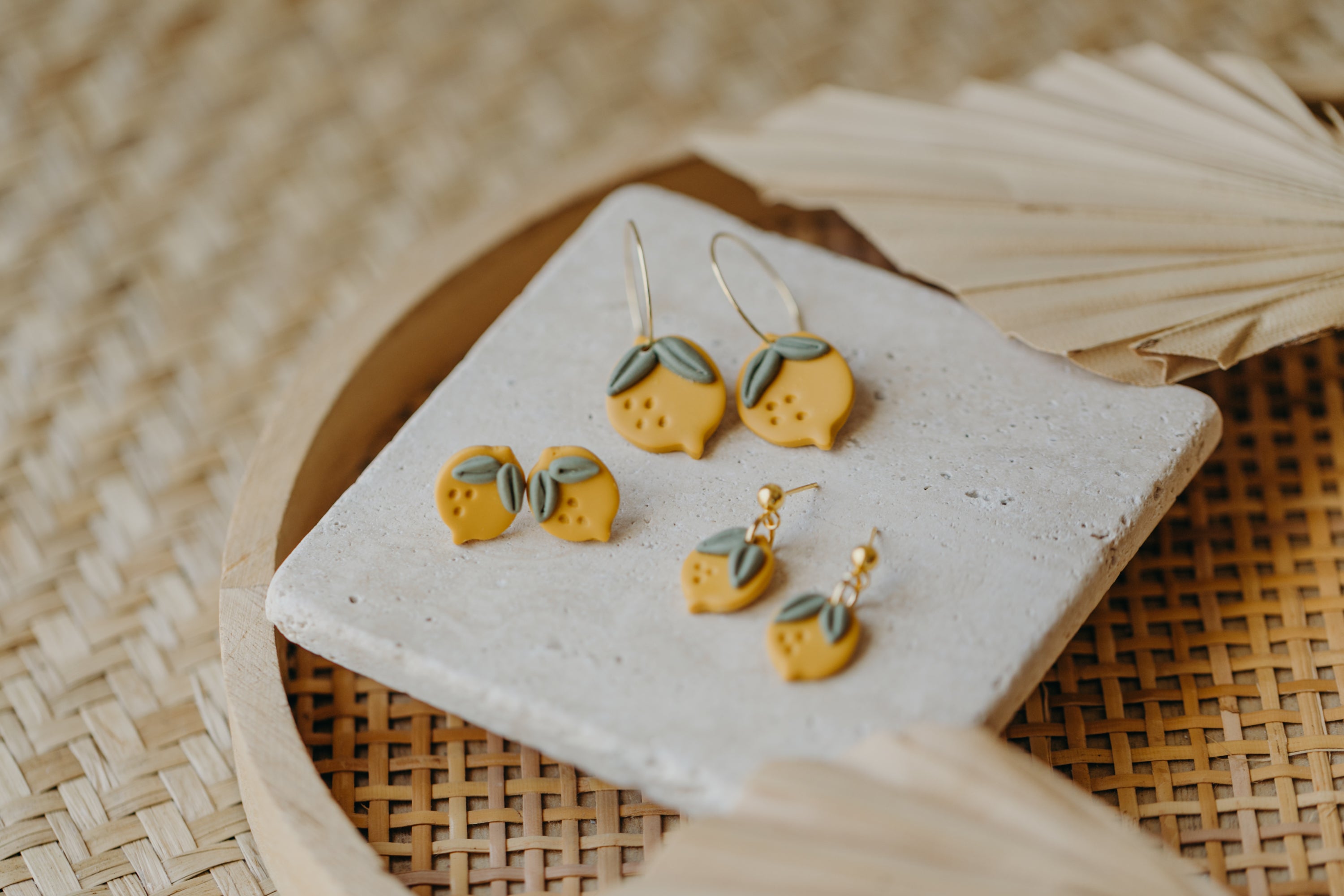 Hoop earrings with round polymer clay pendant and leaf