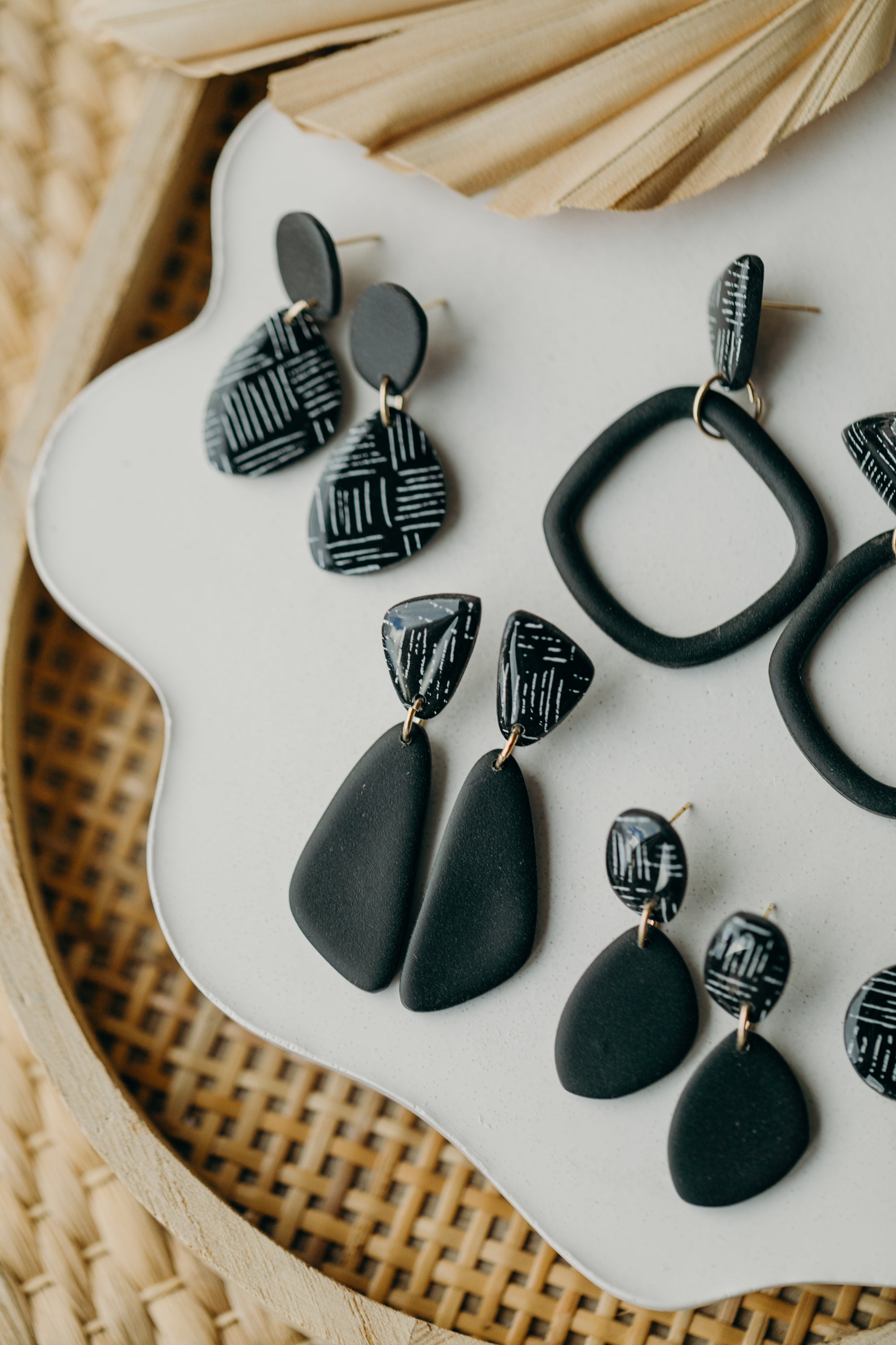 black polymer clay earrings with white pattern