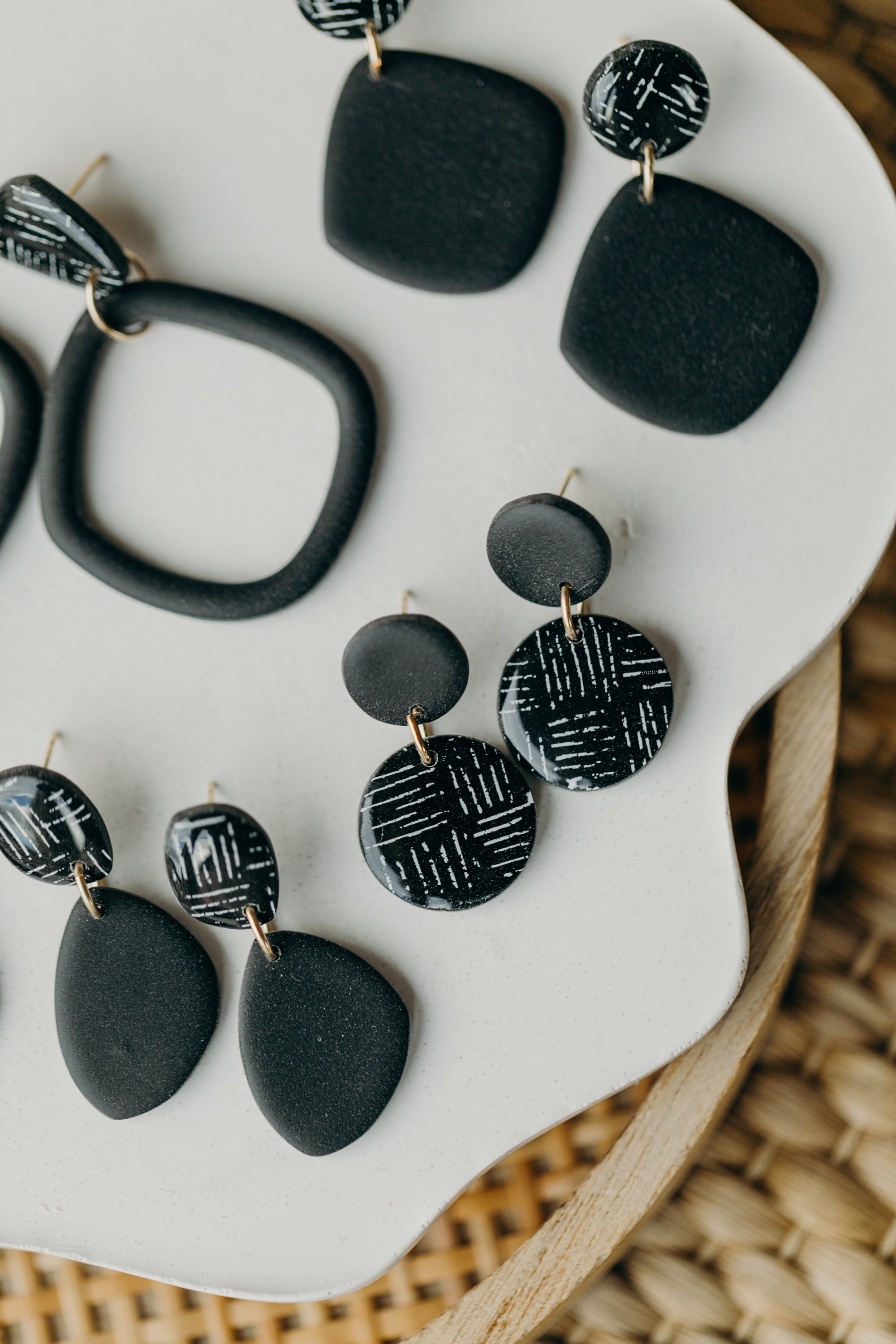 black polymer clay earrings with white pattern