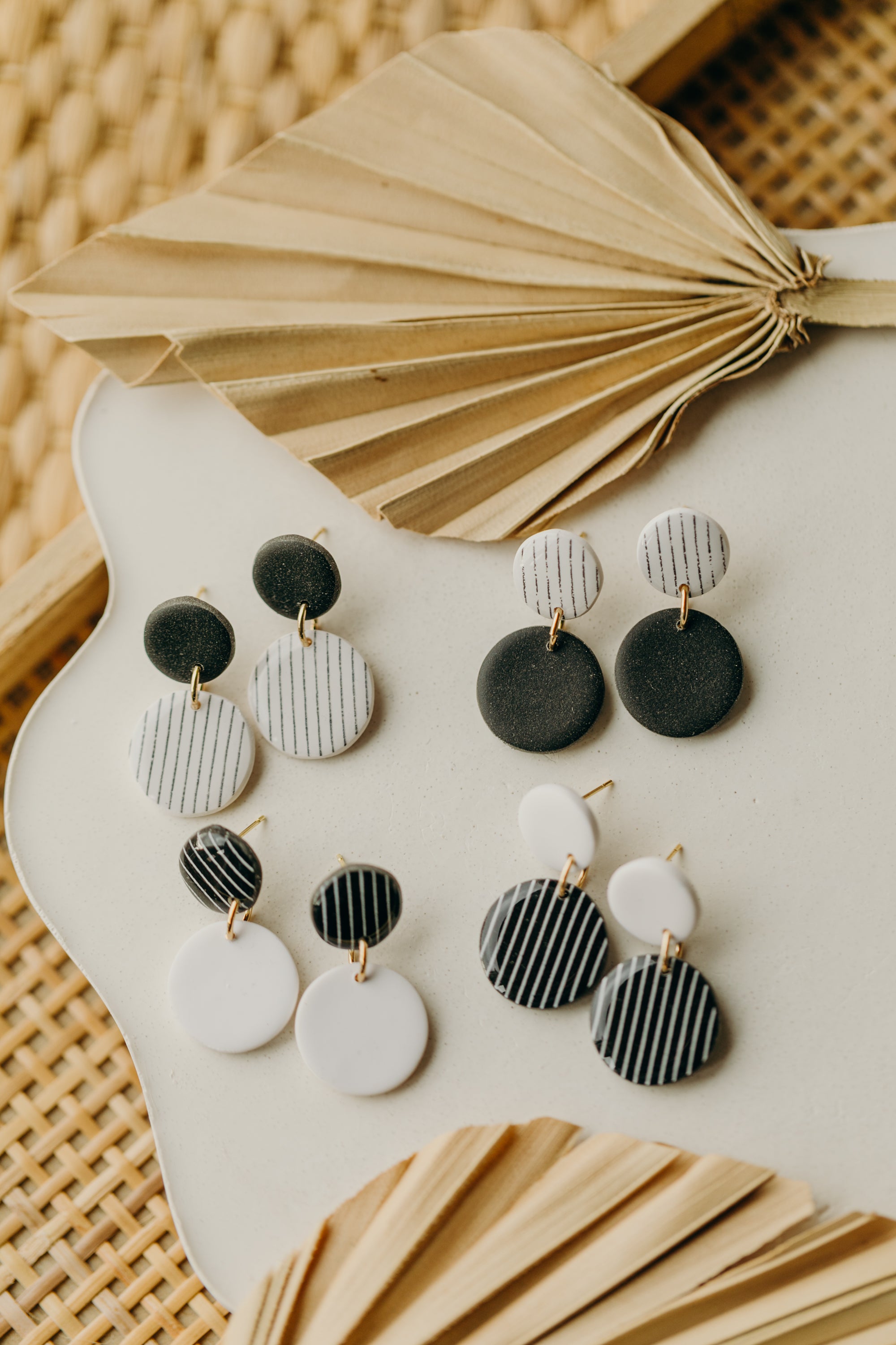 black and white round polymer clay earrings with stripes