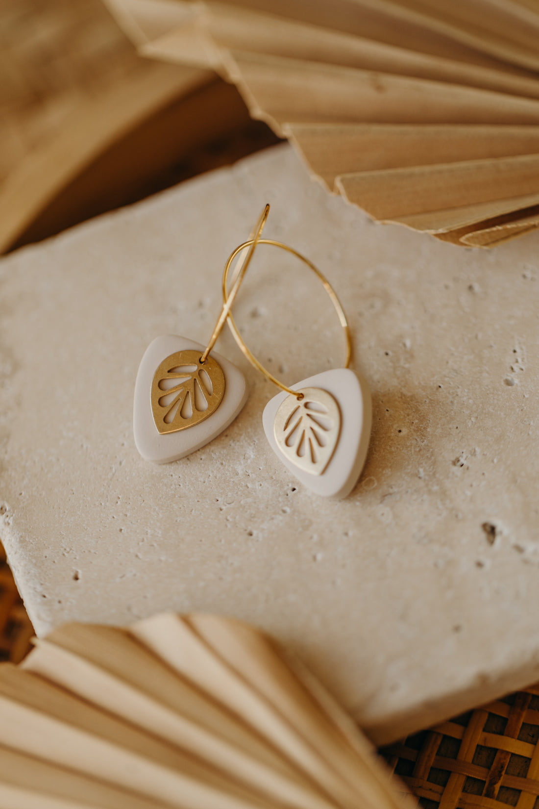 Hoop earrings with round polymer clay pendant and leaf