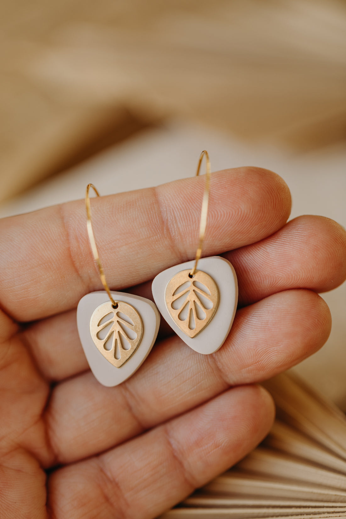 Hoop earrings with round polymer clay pendant and leaf