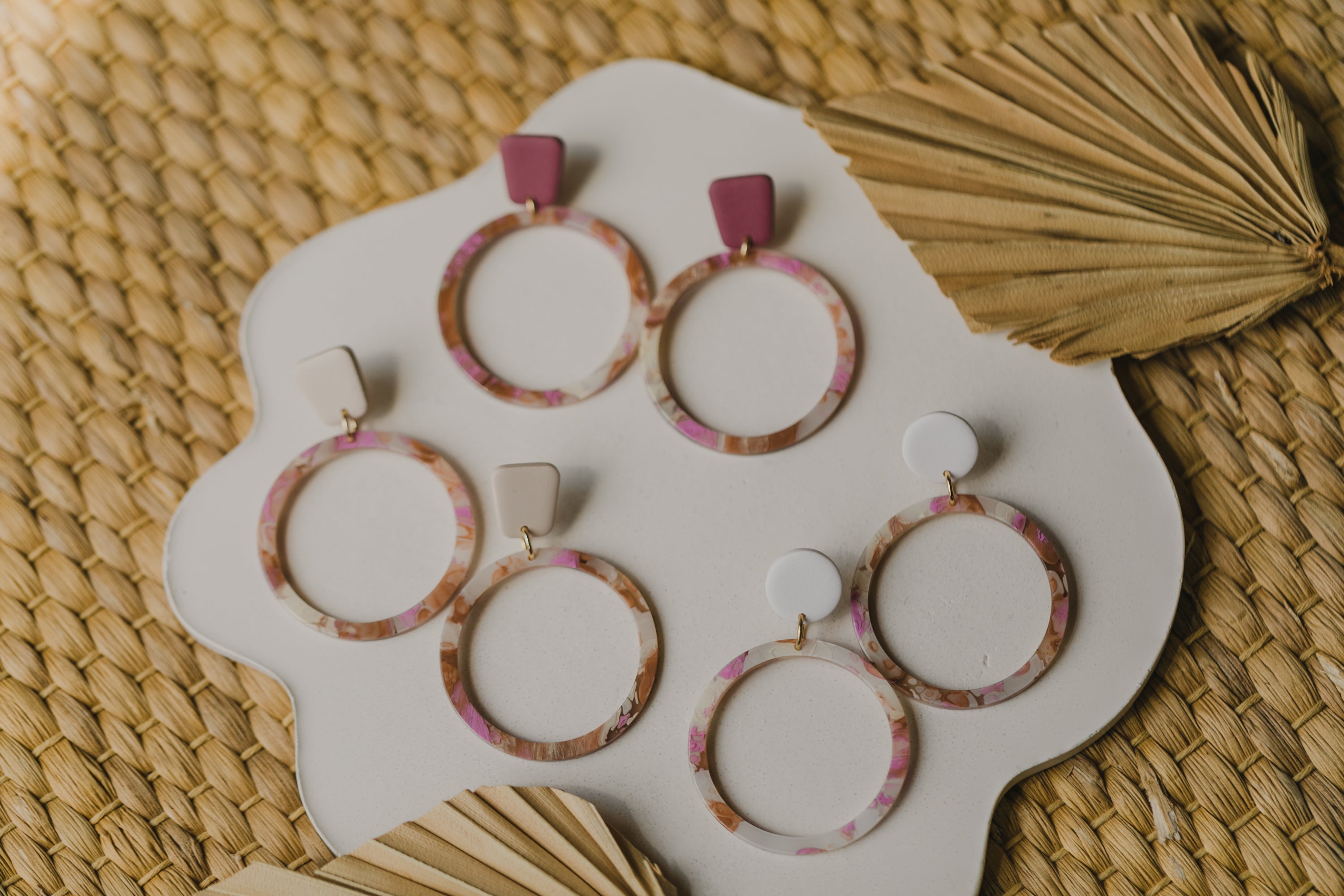 golden earrings with acrylic in white, petrol and brown