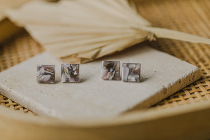 golden earrings with acrylic in white, petrol and brown