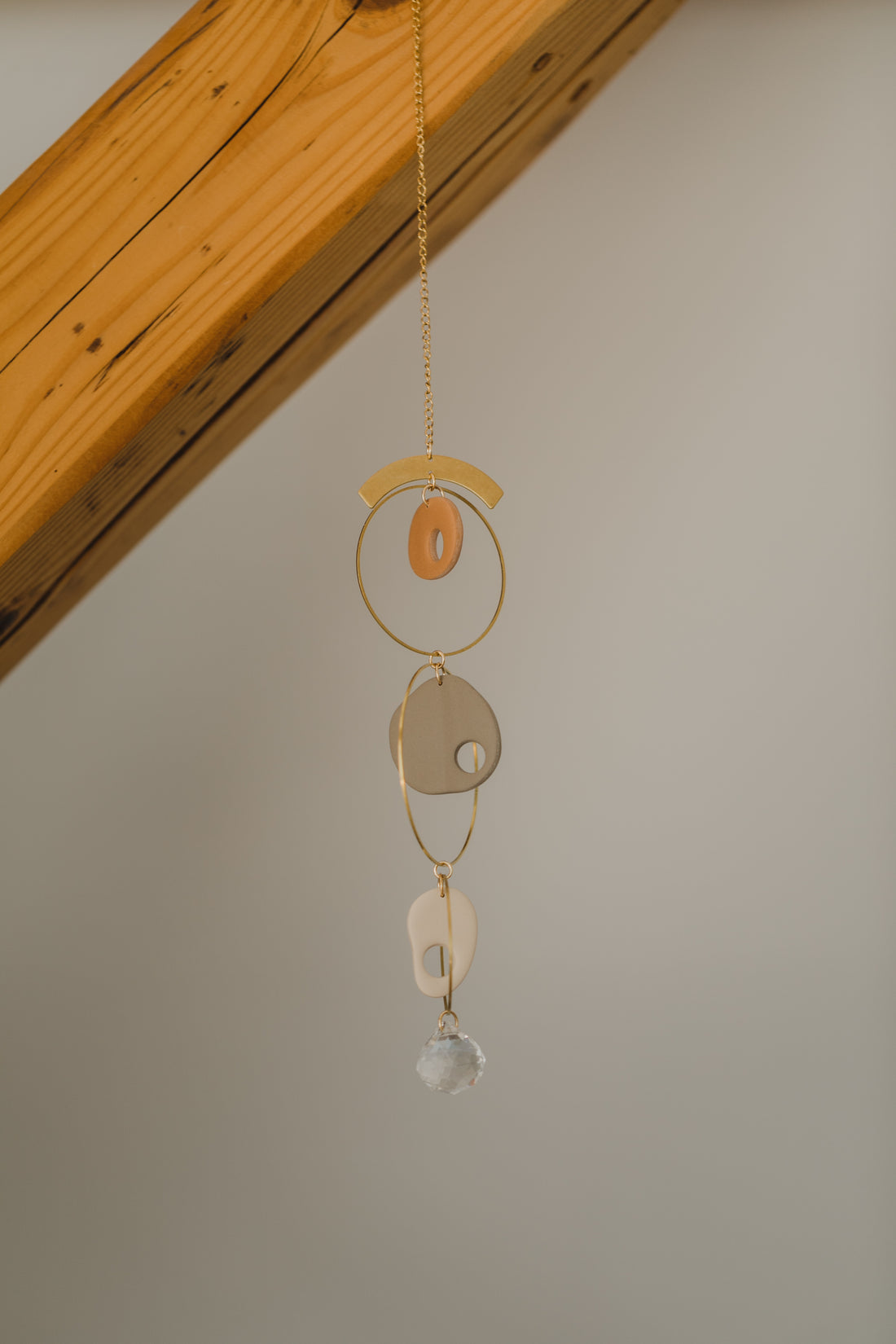 Suncatcher made of polymer clay, brass elements and rainbow crystal