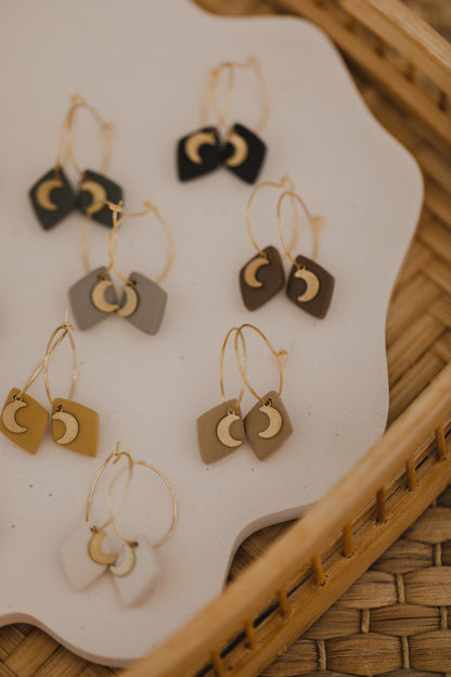 Hoop earrings with round polymer clay pendant and leaf