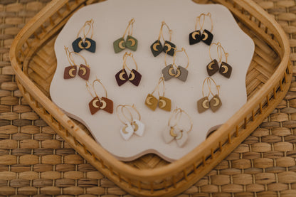 Hoop earrings with round polymer clay pendant and leaf