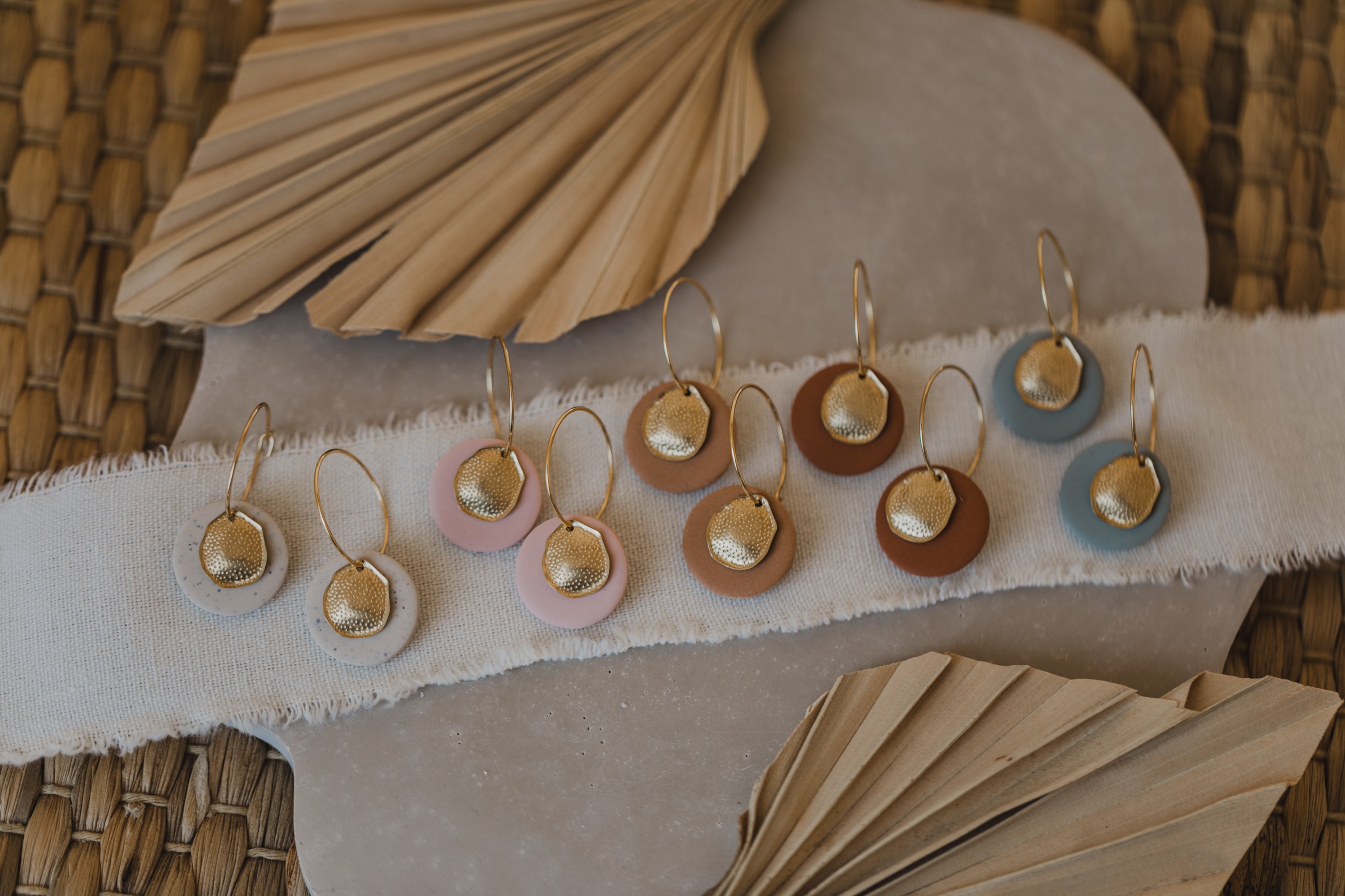 Hoop earrings with round polymer clay pendant and leaf