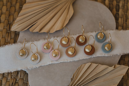 Hoop earrings with round polymer clay pendant and leaf