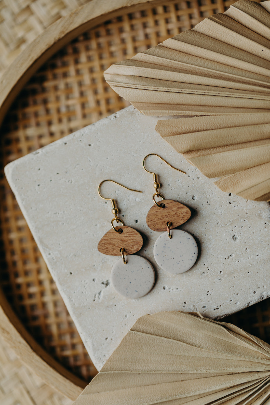 triangular polymer clay earrings in eucalyptus green with rectangular wooden pendant