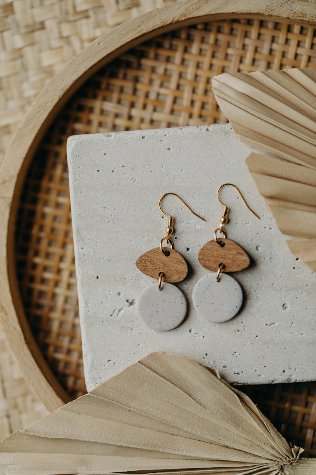 triangular polymer clay earrings in eucalyptus green with rectangular wooden pendant